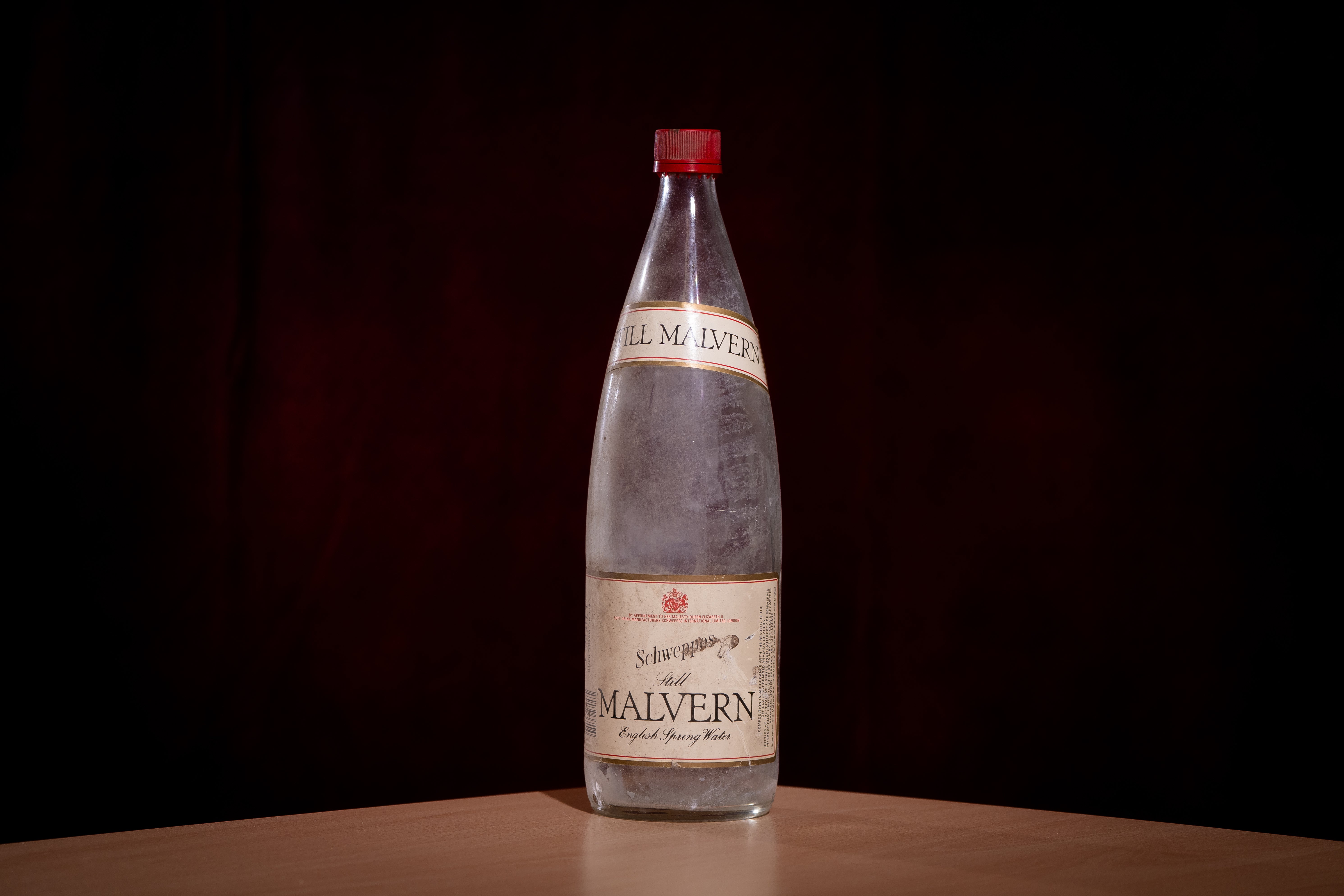 A bottle of Schweppes Malvern English Still Spring Water