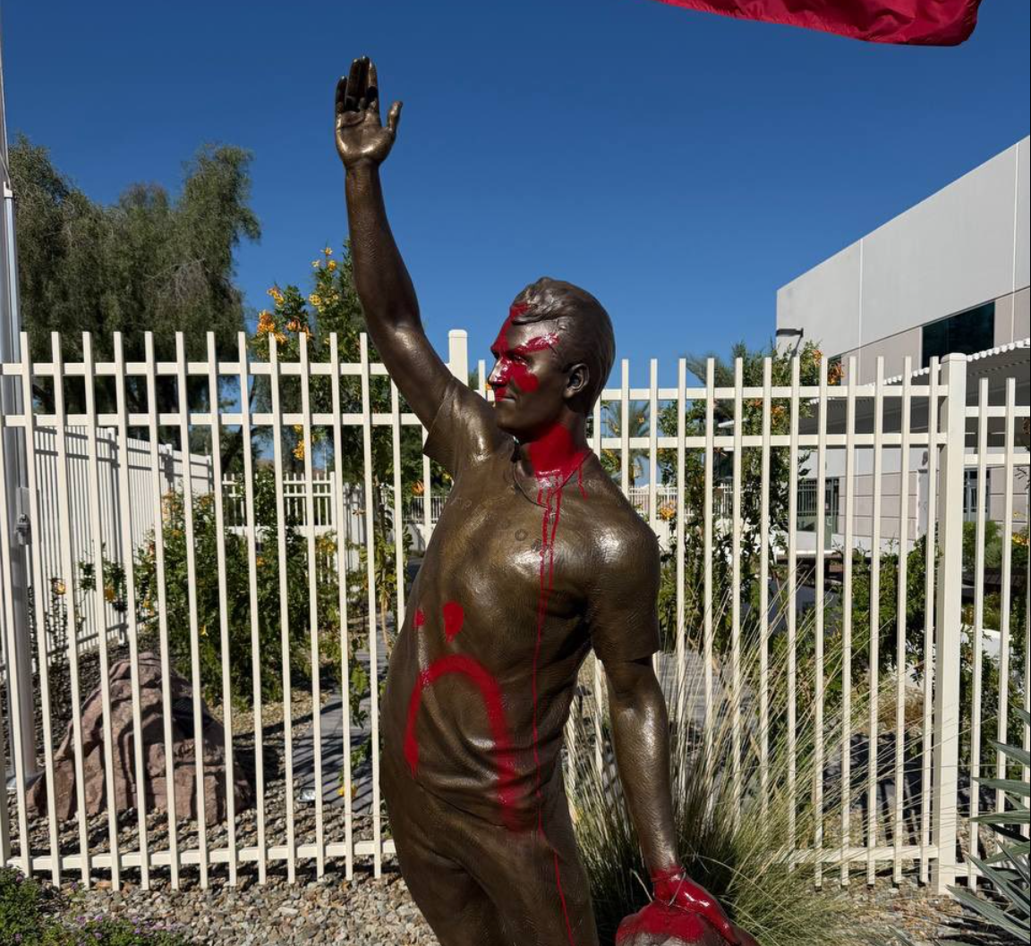 A statue of Charlie Kirk defaced with red paint outside Turning Point USA's headquarters in Phoenix, Arizona