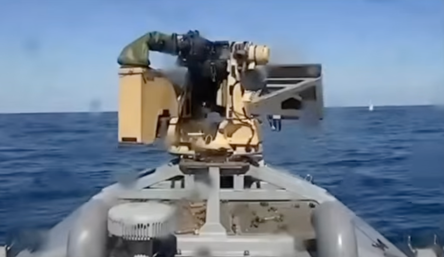 The Ukrainian drone engaged the Russian boat (right) with its gun, destroying it, according to the Ukrainian navy