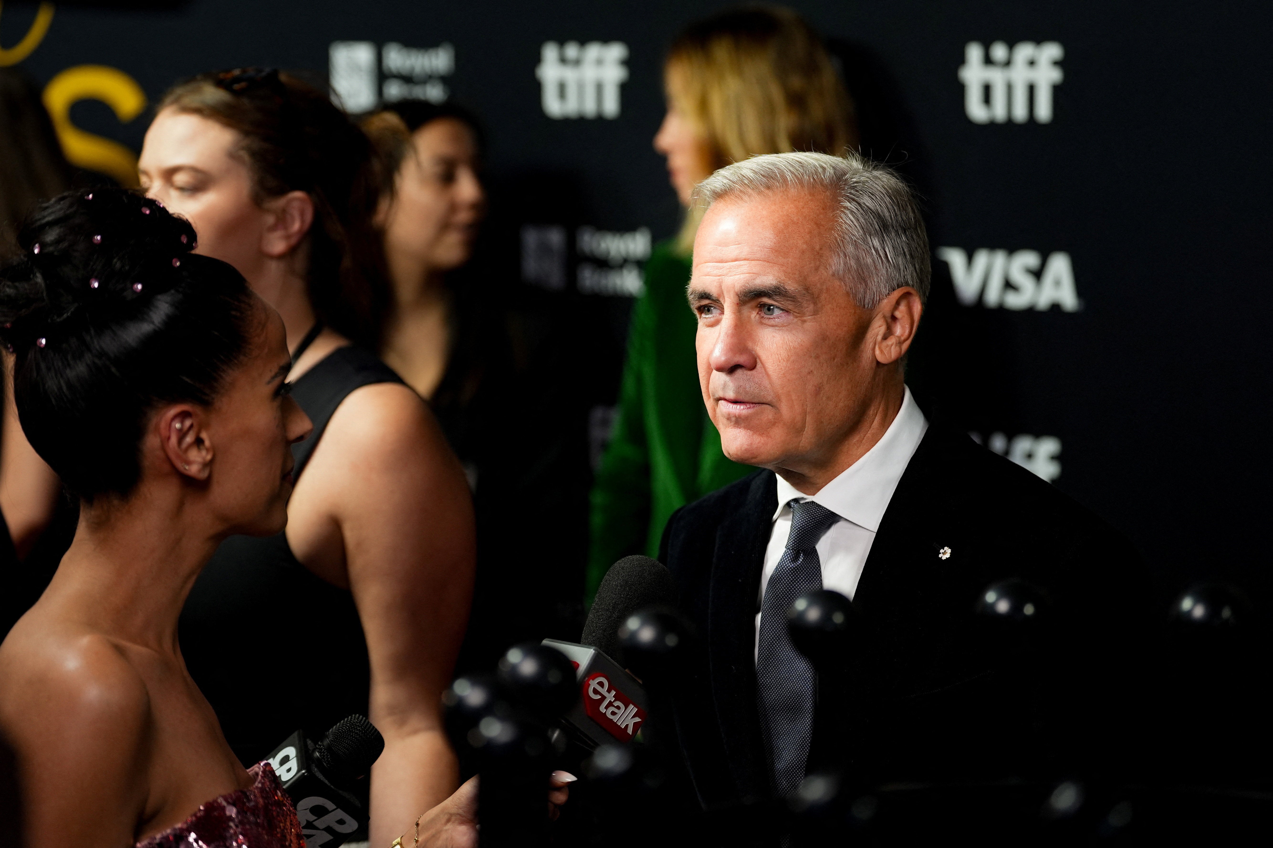 Carney speaks to the media as he attends the Toronto International Film Festival (TIFF) Tribute Awards gala fundraiser