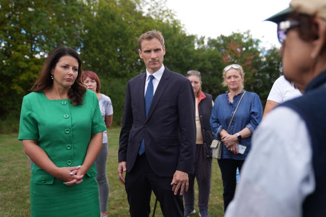Shadow home secretary Chris Philp and shadow minister for women and equalities Joy Morrissey (left) speak with Piddington residents (Joe Giddens/PA)