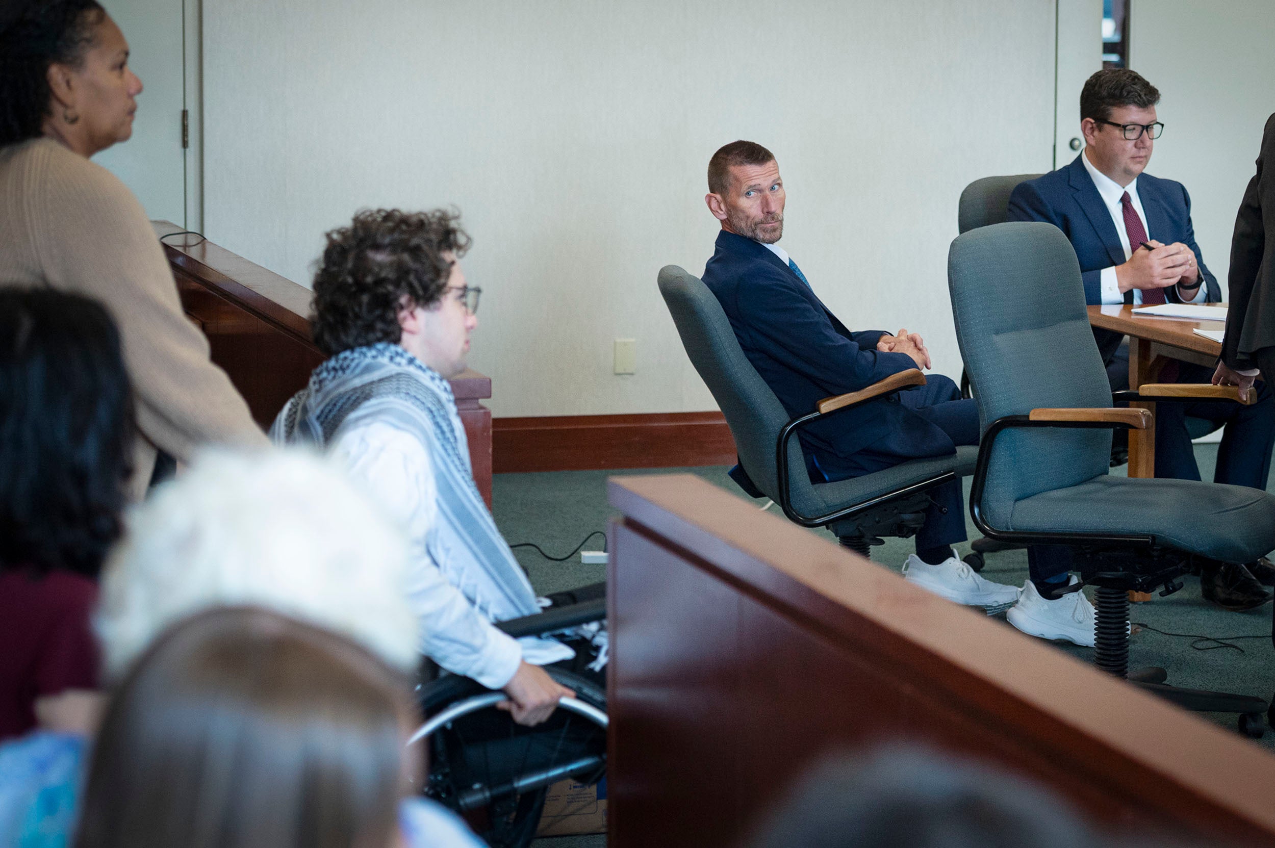 Jason Eaton watches as Hisham Awartani arrives to testify in Eaton's trial in Burlington (Glenn Russell)