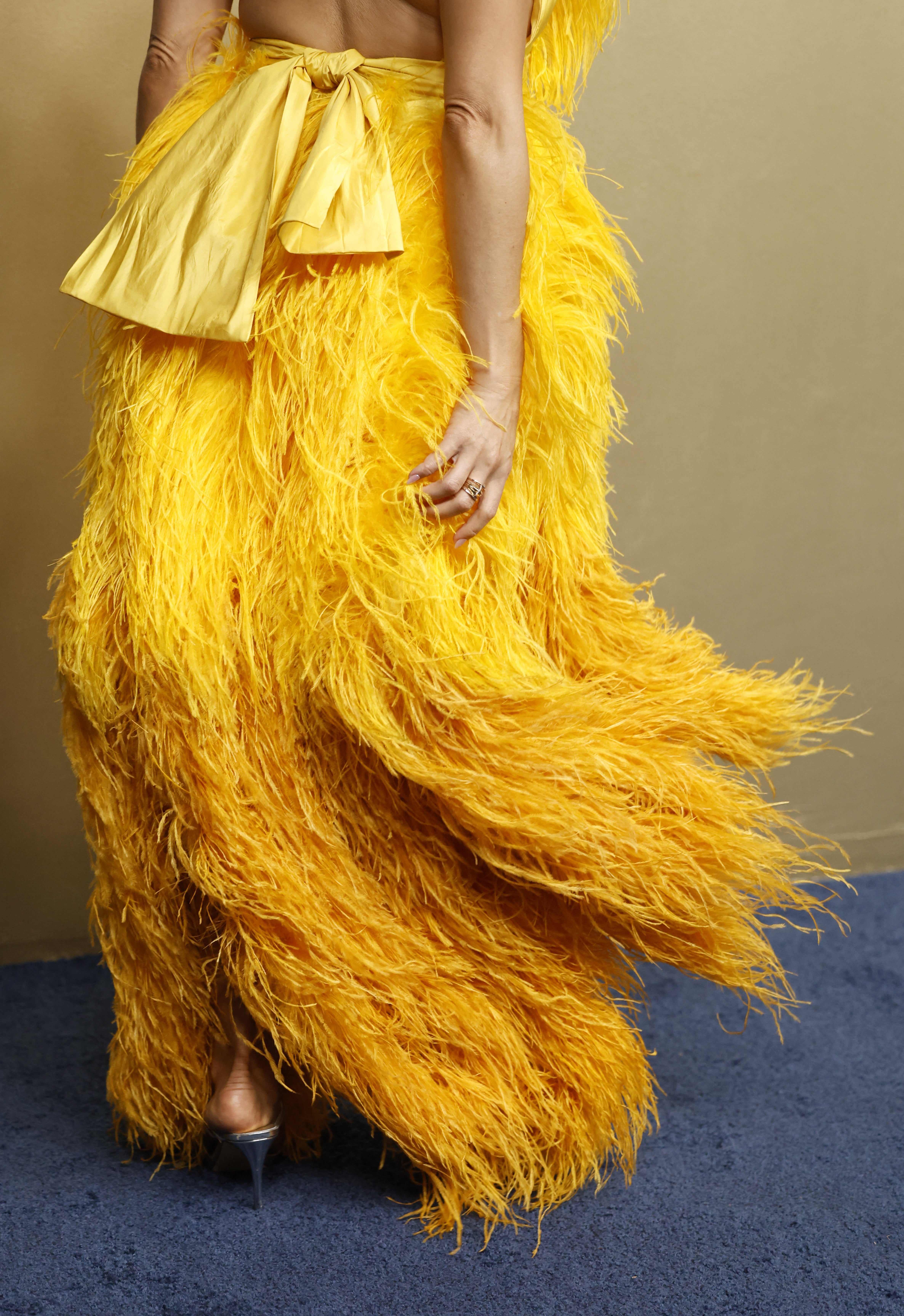 So. Many. Feathers. But also a bow! Big Bird could never.