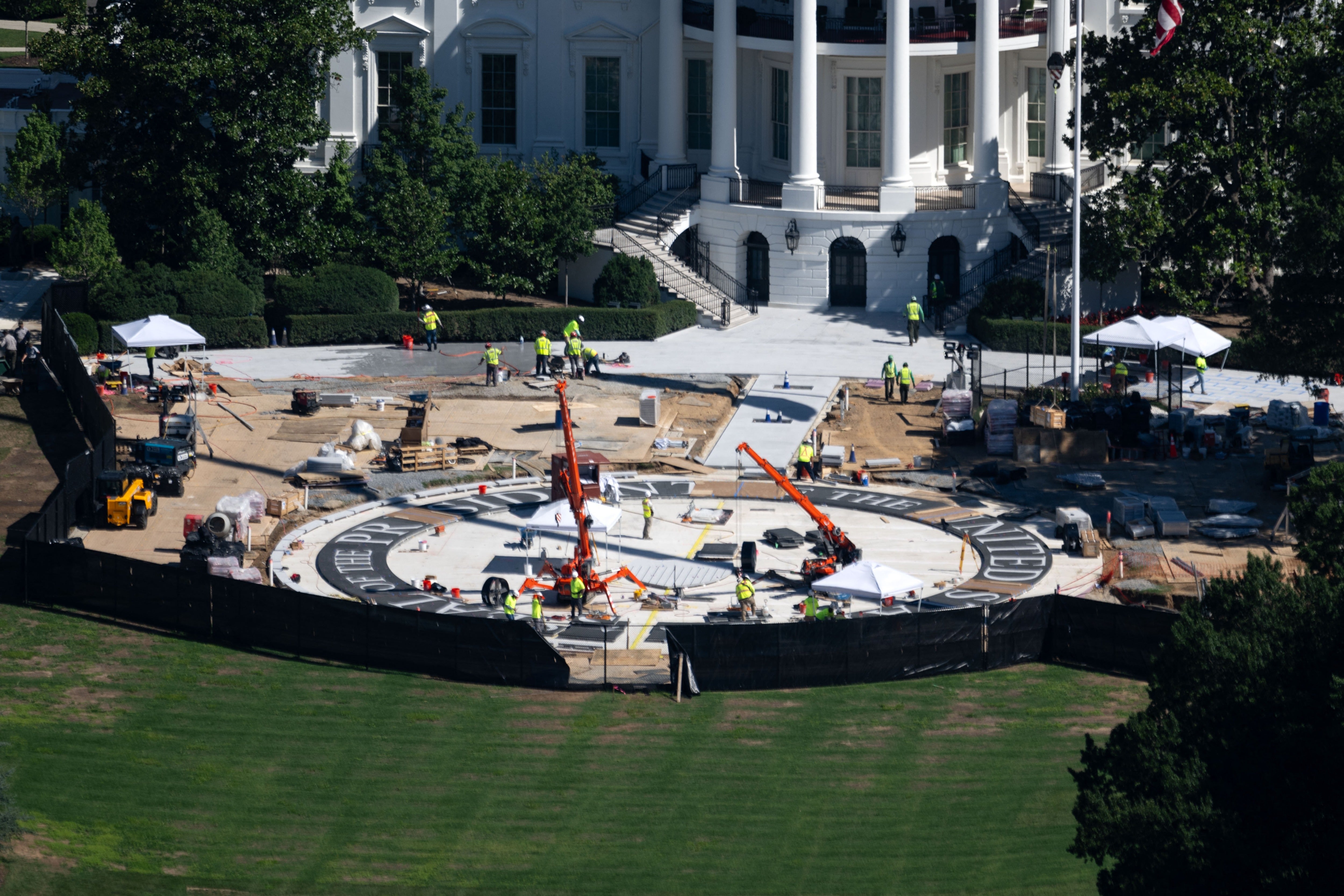 Trump shared a photo of the newly constructed black and white granite ‘heliport landing zone’ on the South Lawn of the White House Monday, calling it a 'work of art'