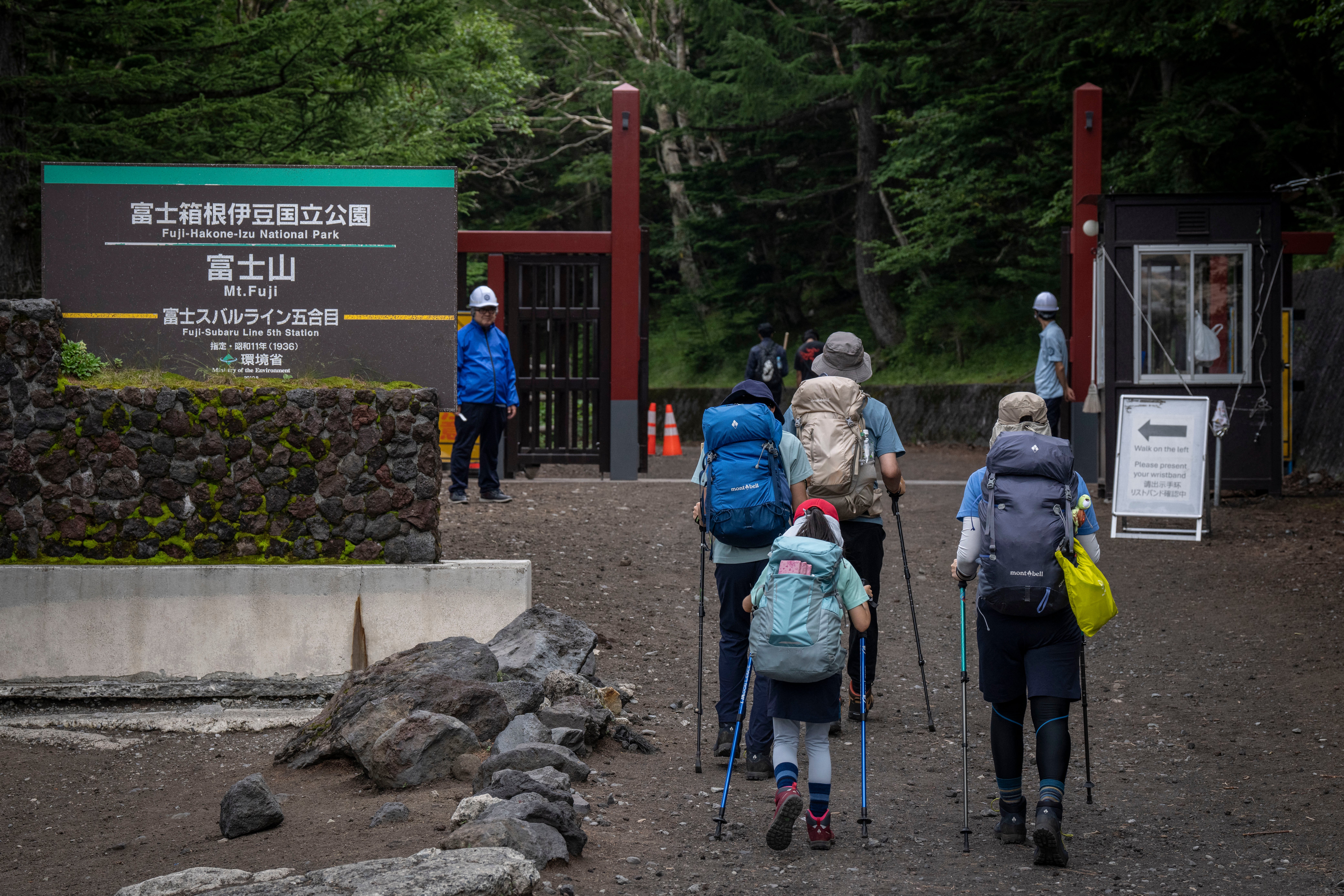 People set off from a trail gate at the fifth station of Mount Fuji to begin their climb in Fujiyoshida, Yamanashi prefecture, on 23 July 2026 (AFP/Getty)