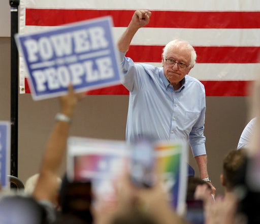 Sen. Bernie Sanders, I-Vt., walks onto the stage during a Get Out the Vote campaign event supporting Massachusetts Sen. Ed Markey in Boston