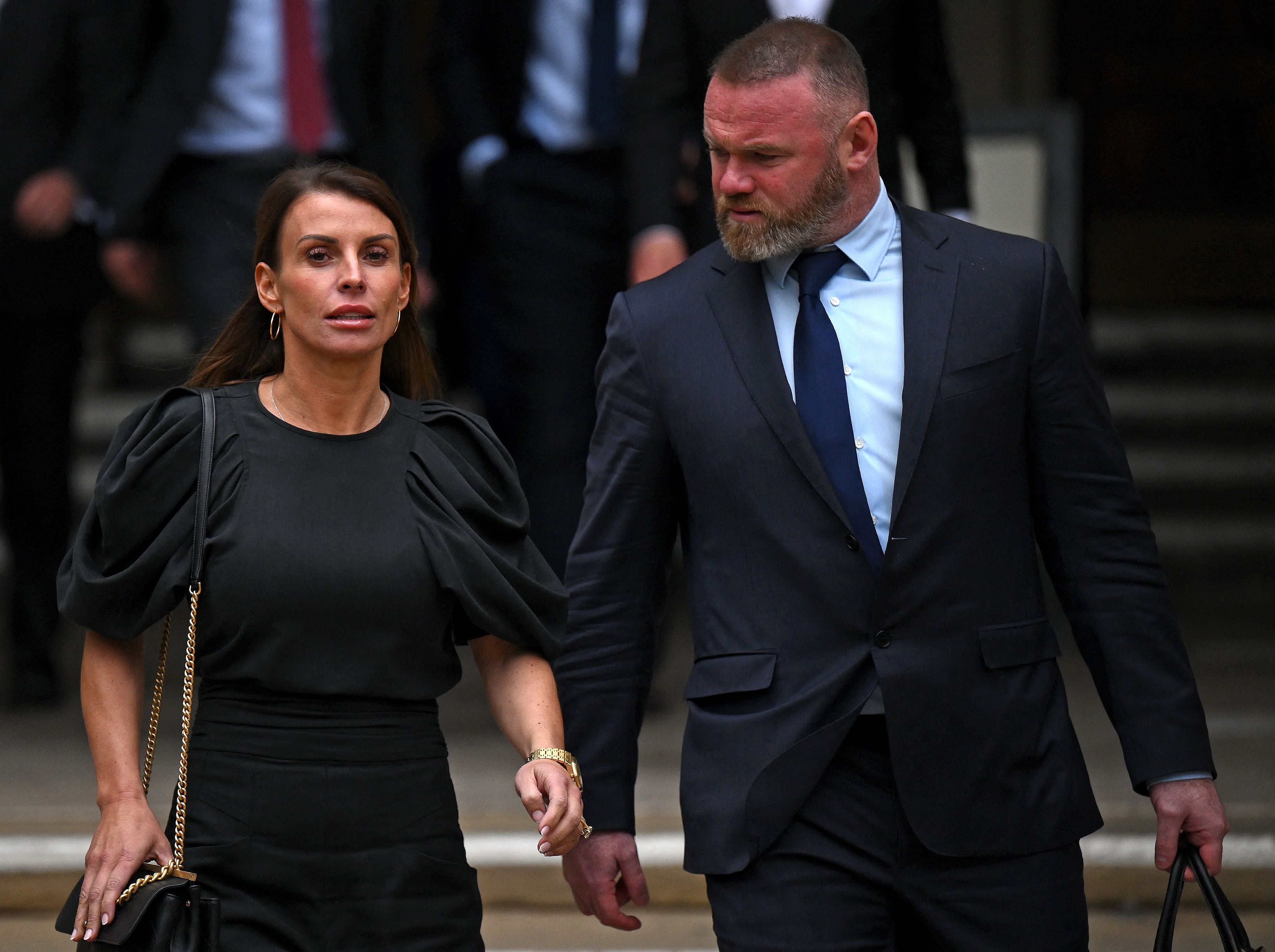 Coleen and Wayne Rooney leaving court in 2022 amid the ‘Wagatha’ legal row (AFP/Getty)