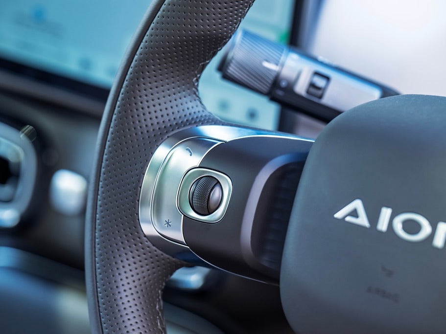 The steering wheel-mounted buttons could do with a bit of explanation – a graphic showing what they do would be useful (Aion)