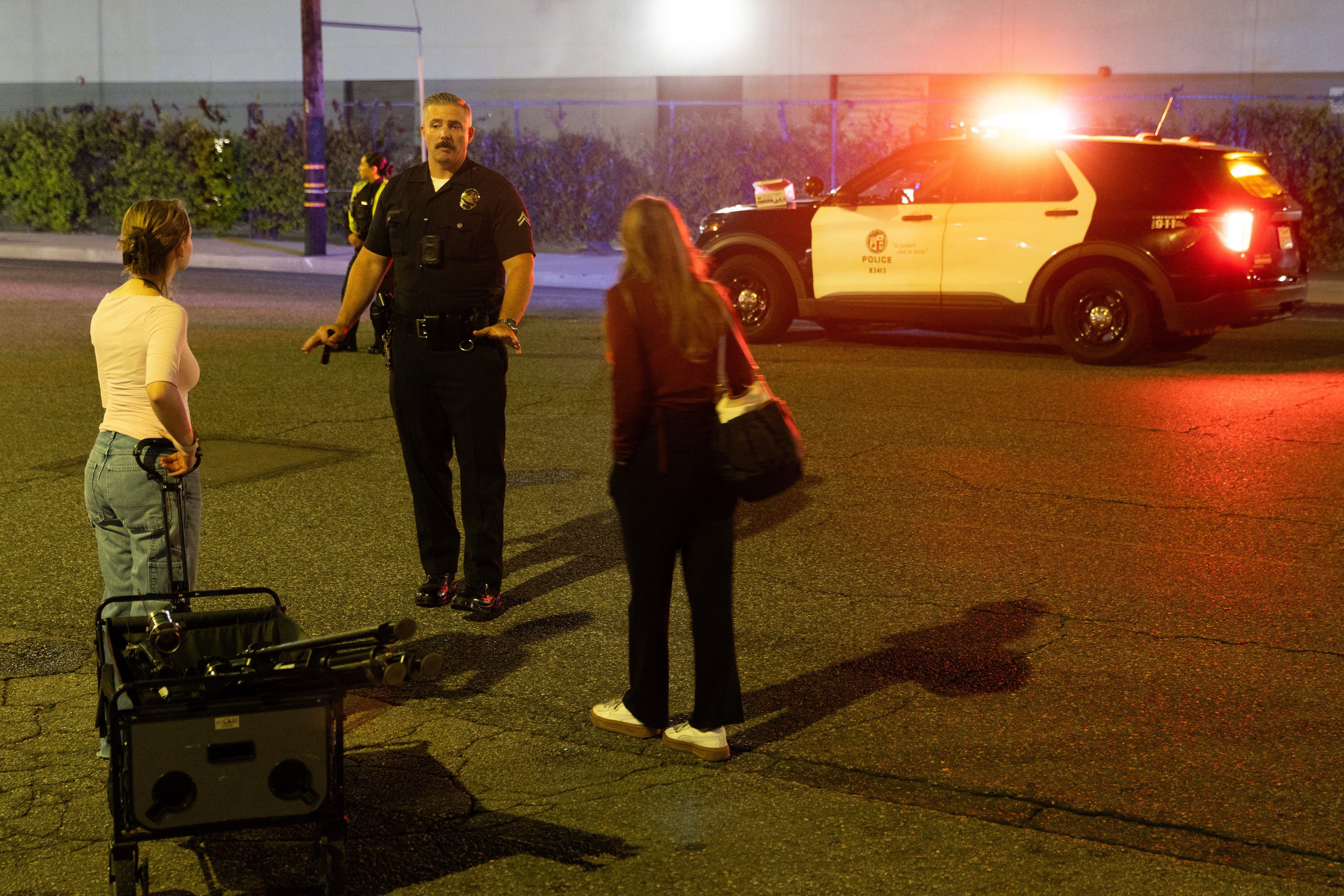 A Los Angeles Police officer speaks with reporters near the scene (AFP/Getty)