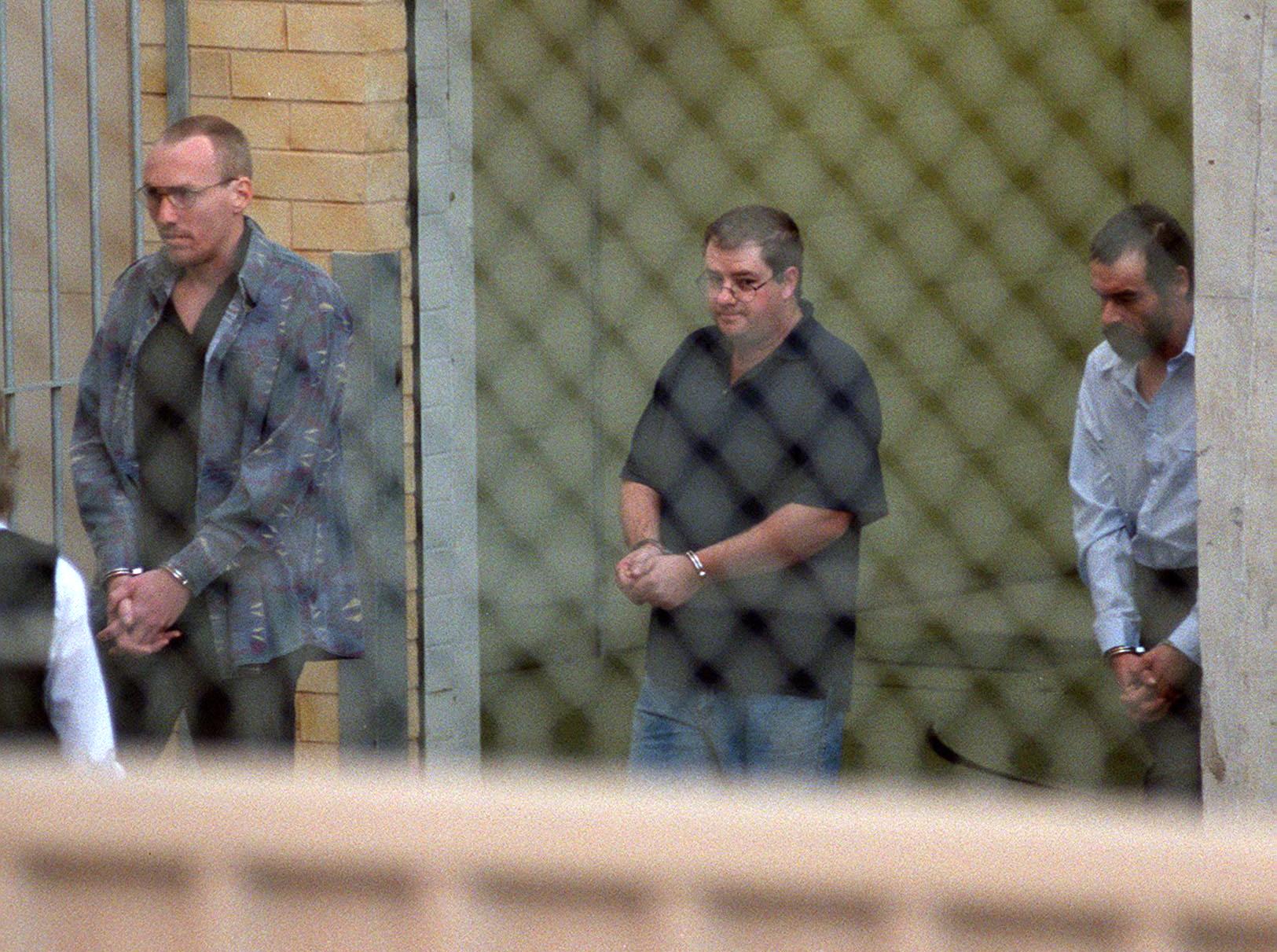 Robert Joe Wagner, left, John Justin Bunting, and Mark Ray Haydon after their arrest in Snowtown, South Australia, on 21 May 1999