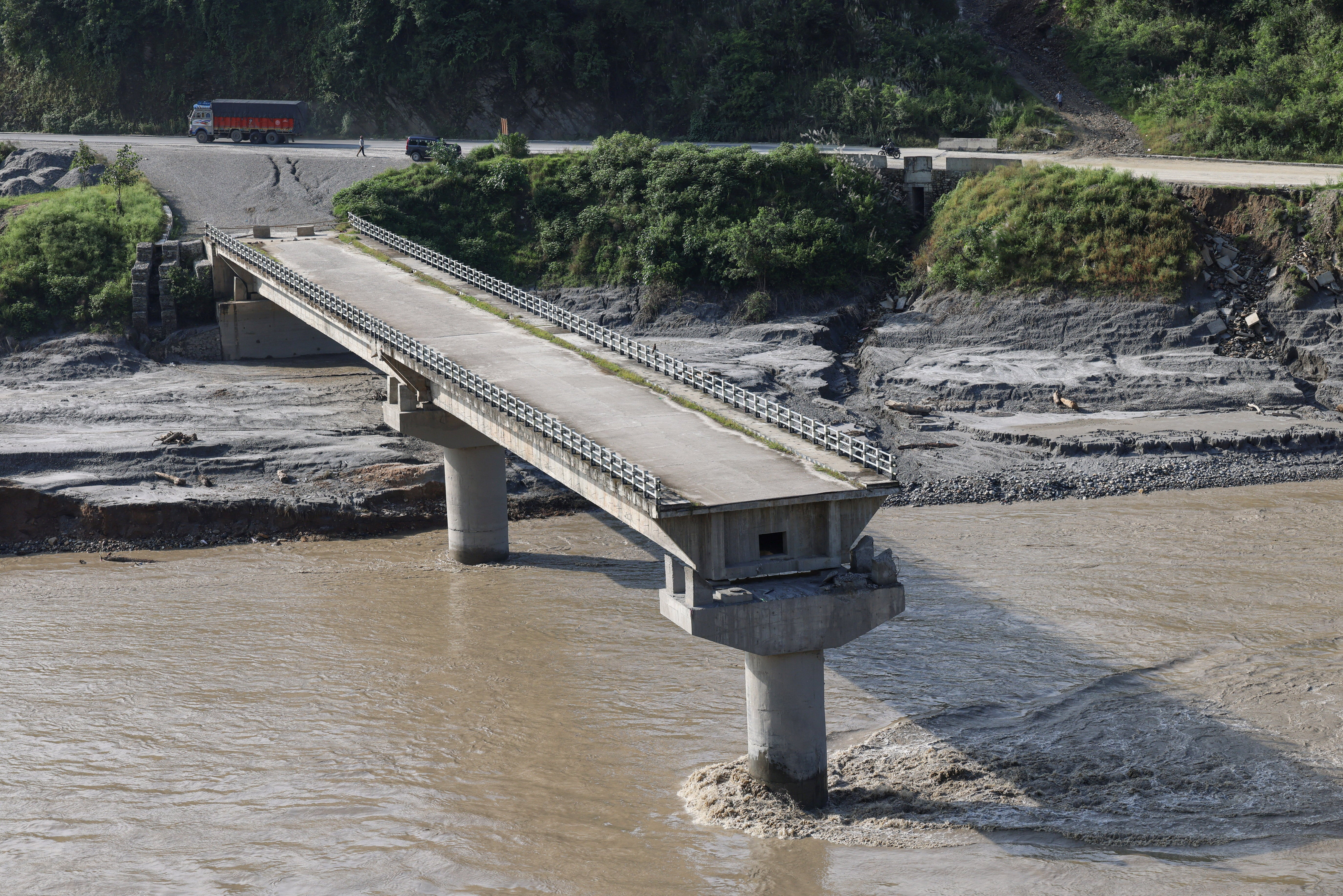 A bridge damaged by deadly flash floods and a mudslide, in Dhading district, Nepal (Reuters)