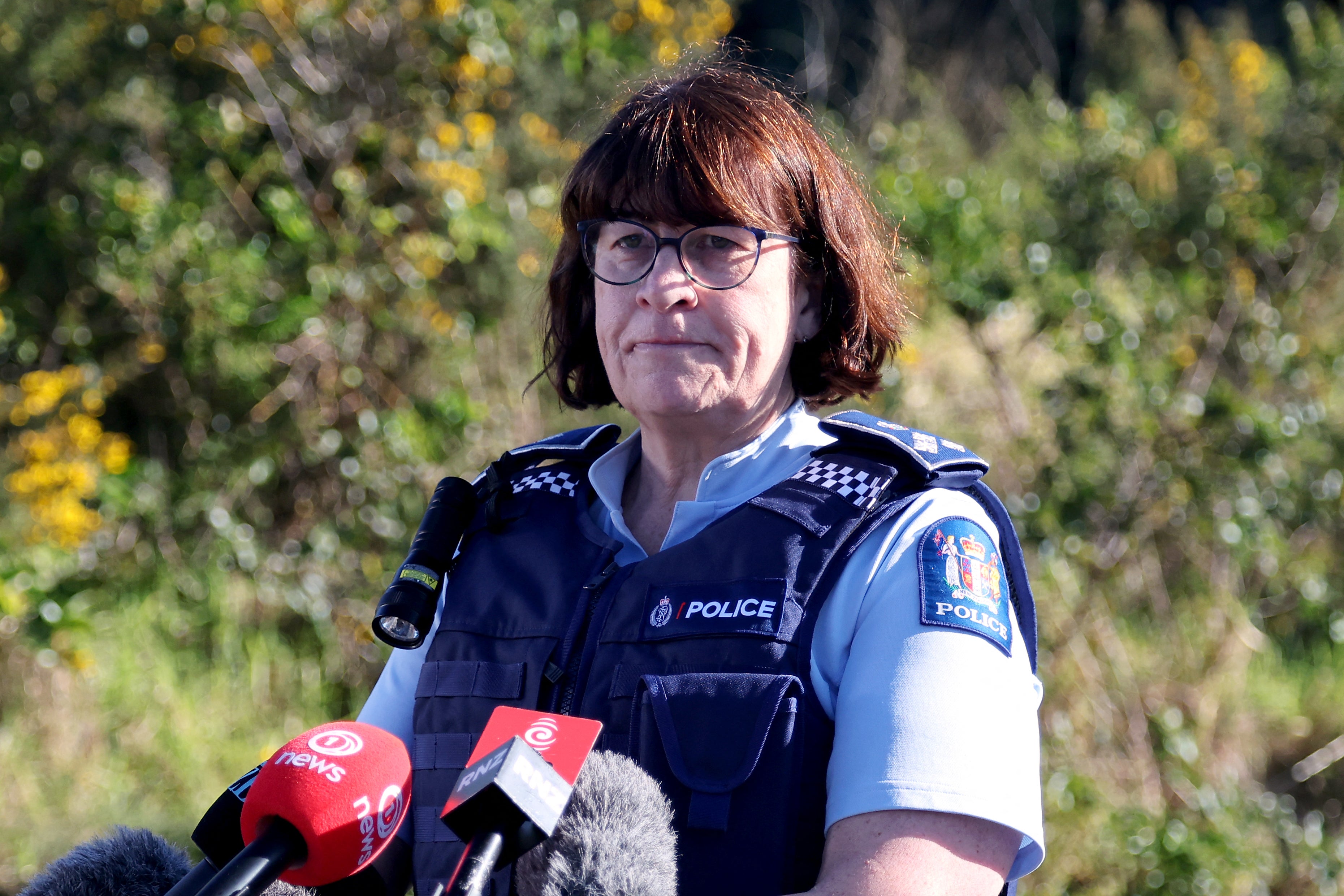New Zealand Police Acting Deputy Commissioner Jill Rogers reacts during a media briefing at a roadblock where a police shootout occurred near the town of Piopio, located in New Zealand's Waikato region on September 8, 2025