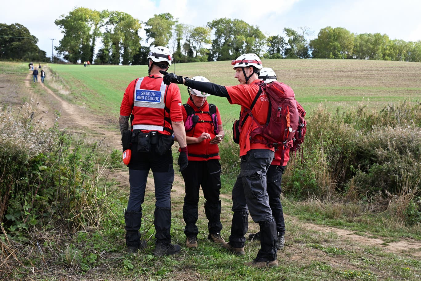 Members of a search and rescue team near Merriam Close, Brantham. PA