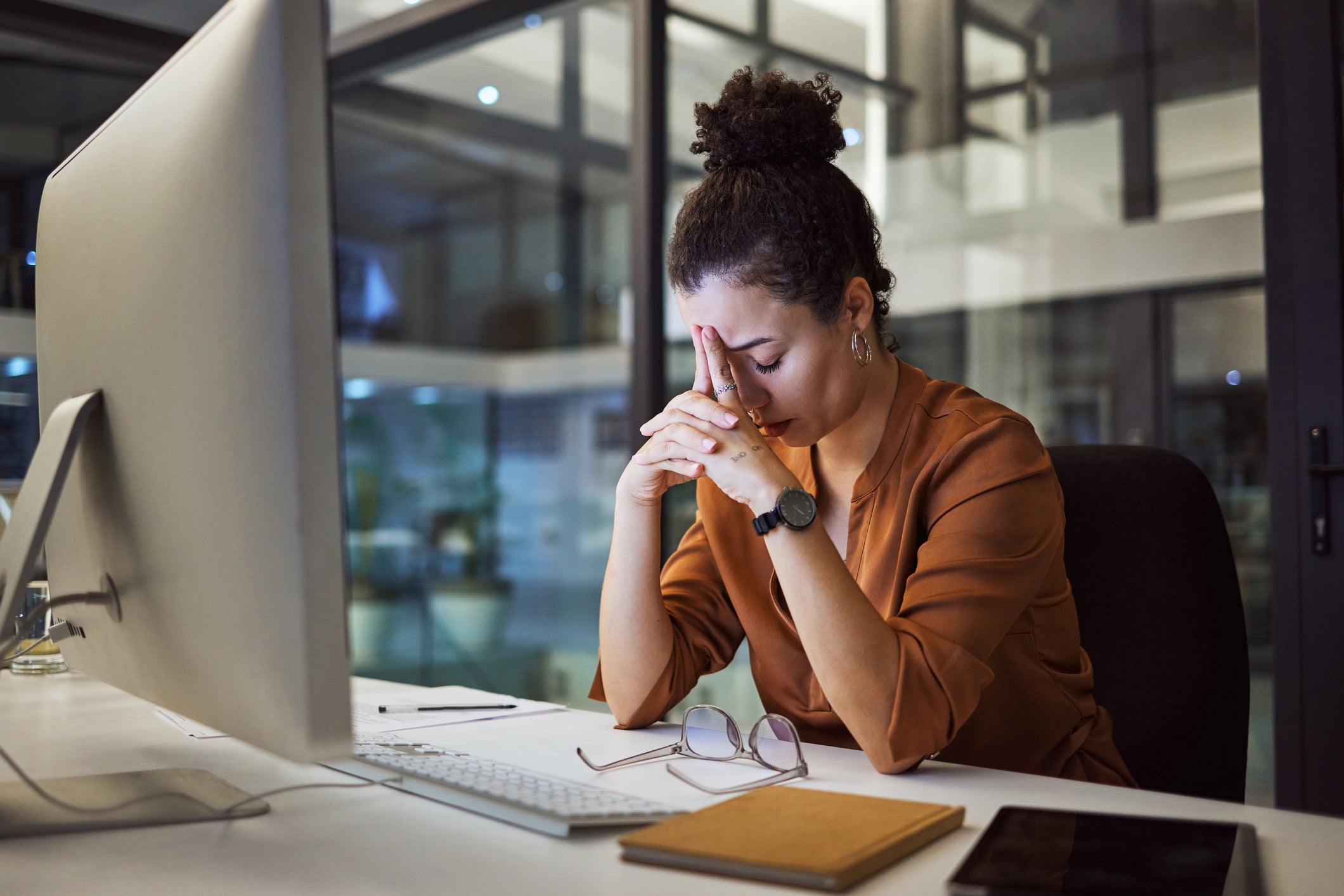 A person with ADHD may work long hours to complete their work, but are more at risk of burnout as a result.