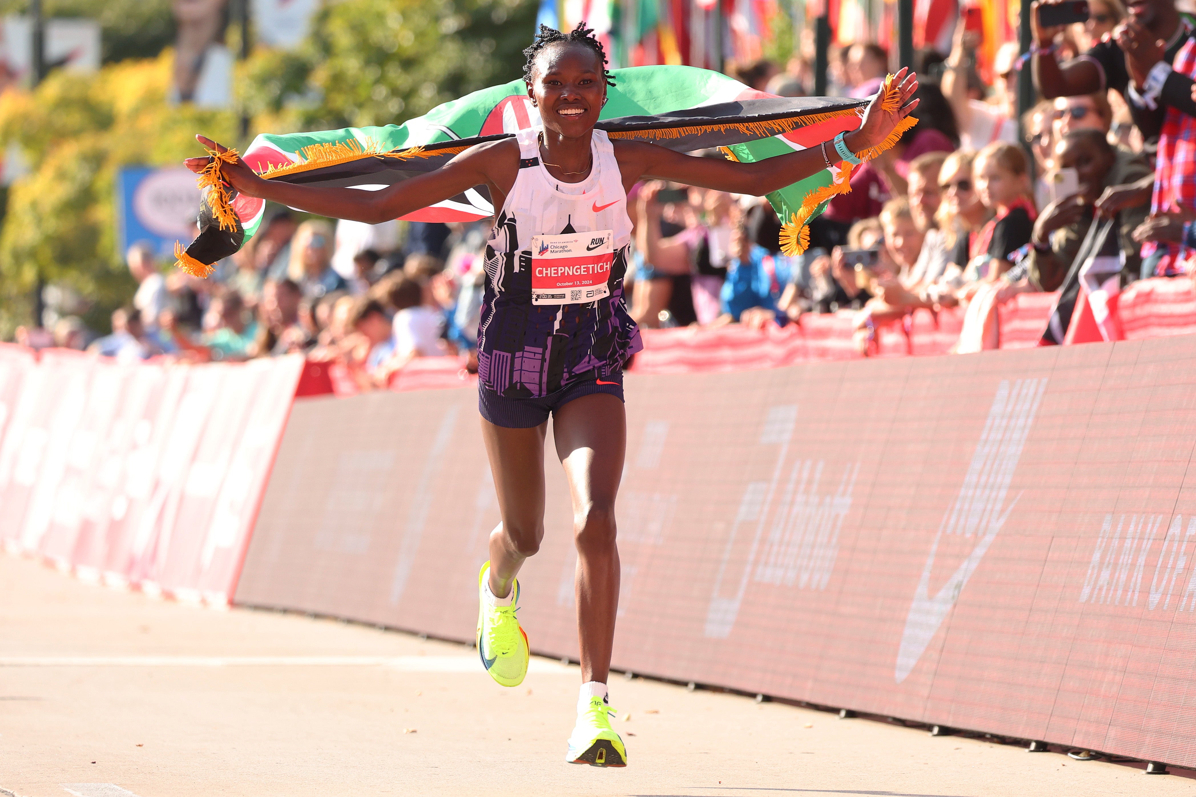 Ruth Chepngetich celebrates after crossing the finish line to win the 2024 Chicago Marathon