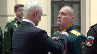 Russian Defence Minister Andrei Belousov awards General Anton Grunis the Gold Star medal and the title of Hero of Russia for courage displayed in carrying out tasks during Russia's military campaign against Ukraine, at a ceremony in Moscow, Russia, in this still image from video released August 28, 2026.