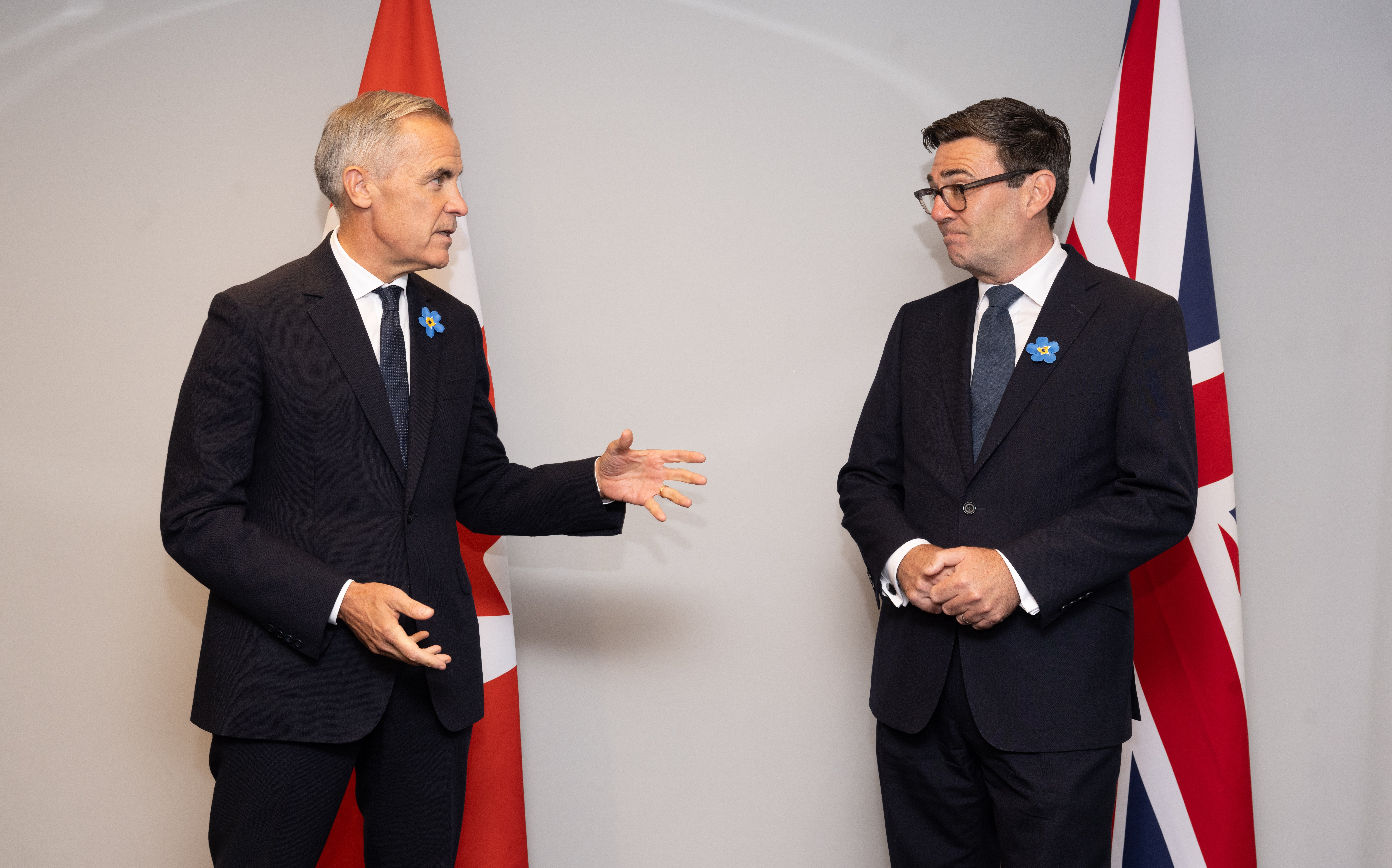 Both men wore forget-me-not flower lapel pins which recognise Alzheimer’s support