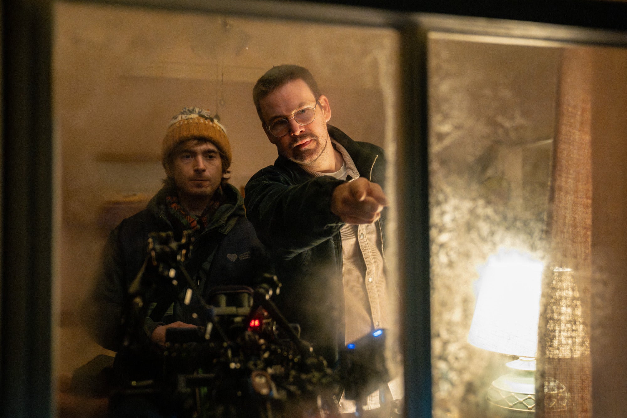 Austin Abrams, left, with director Zach Cregger on the set of Resident Evil (Sony Pictures via AP)