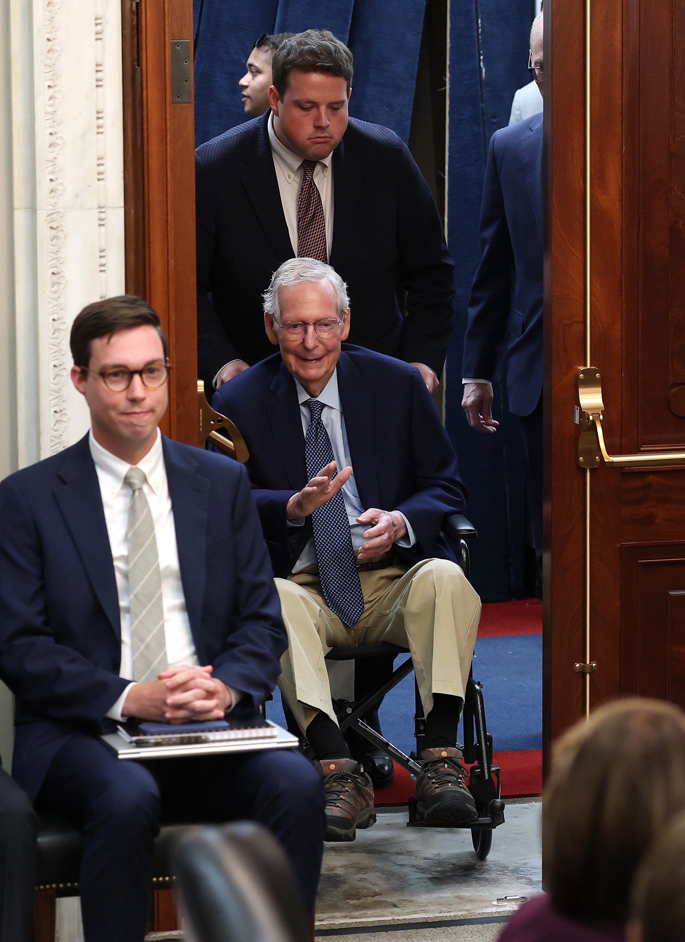 McConnell arrives Wednesday at the Agriculture committee meeting, assisted by an aide
