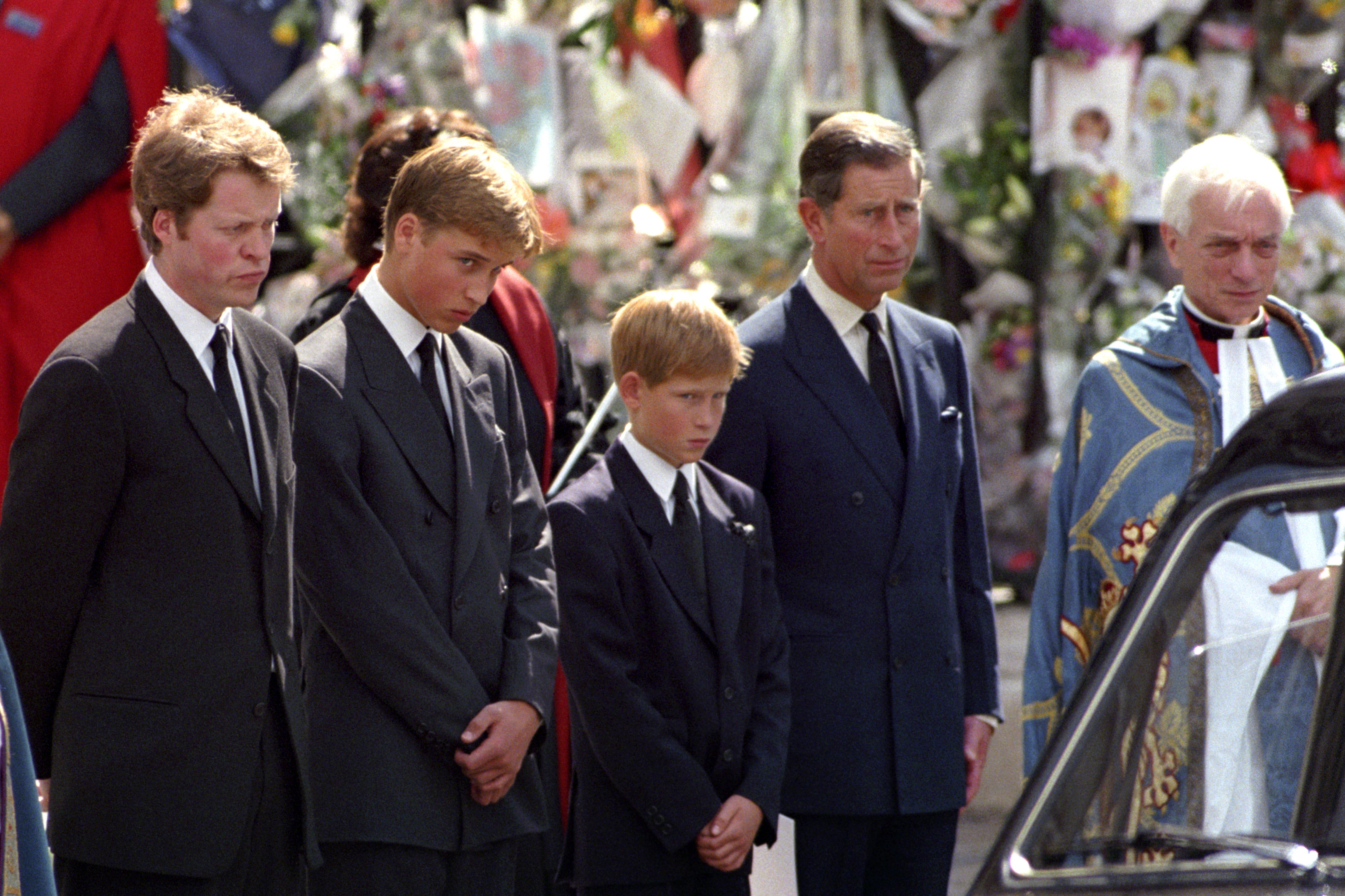 Earl Spencer, William, Harry and Charles waiting as the hearse carrying the coffin of Diana, Princess of Wales prepared to leave Westminster Abbey following her funeral