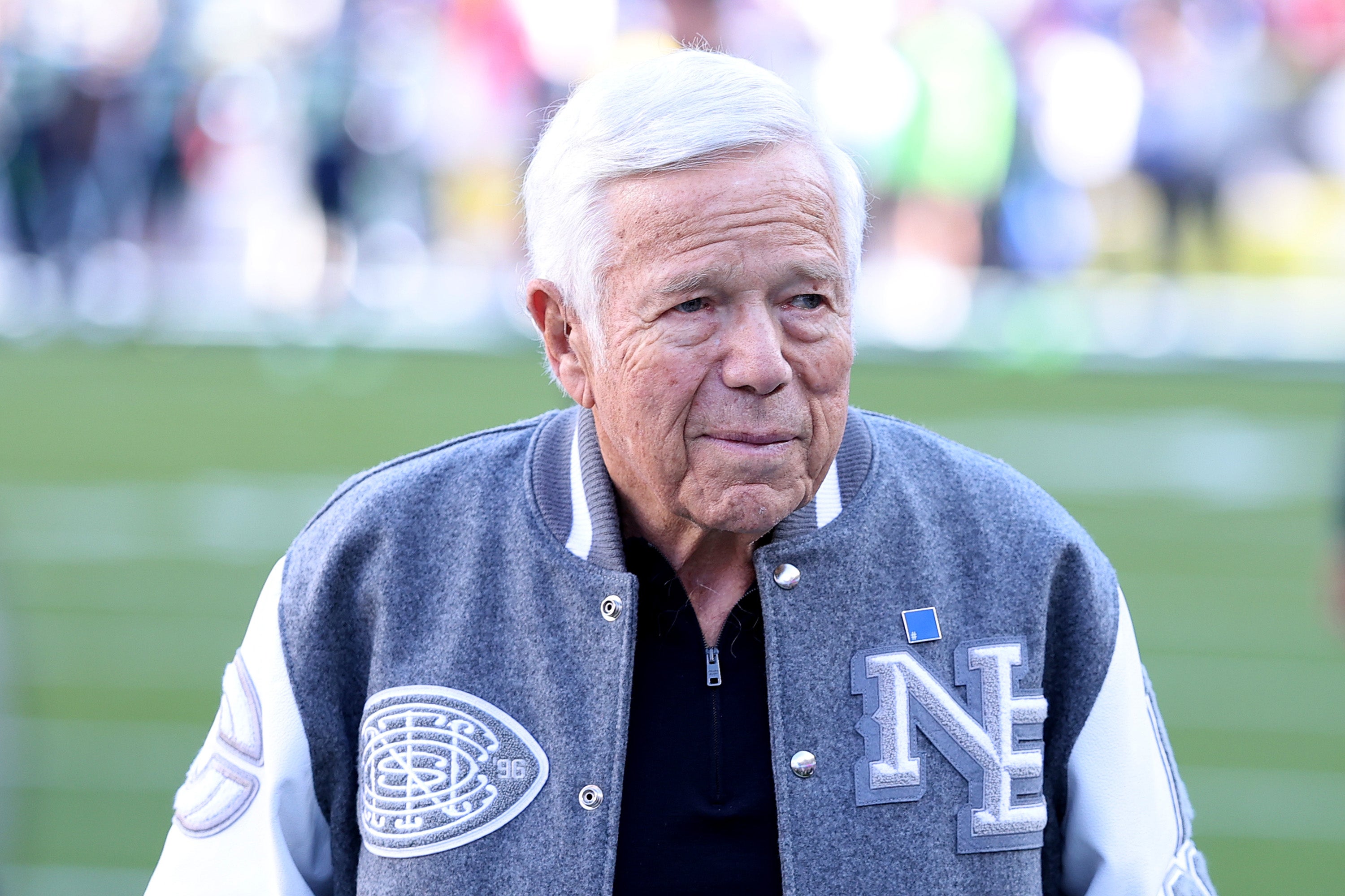 Billionaire sports executive Robert Kraft announced Wednesday that he and musician Ed Sheeran would each donate $2 million toward humanitarian relief for Palestinians, following a challenge to do so from rapper Macklemore