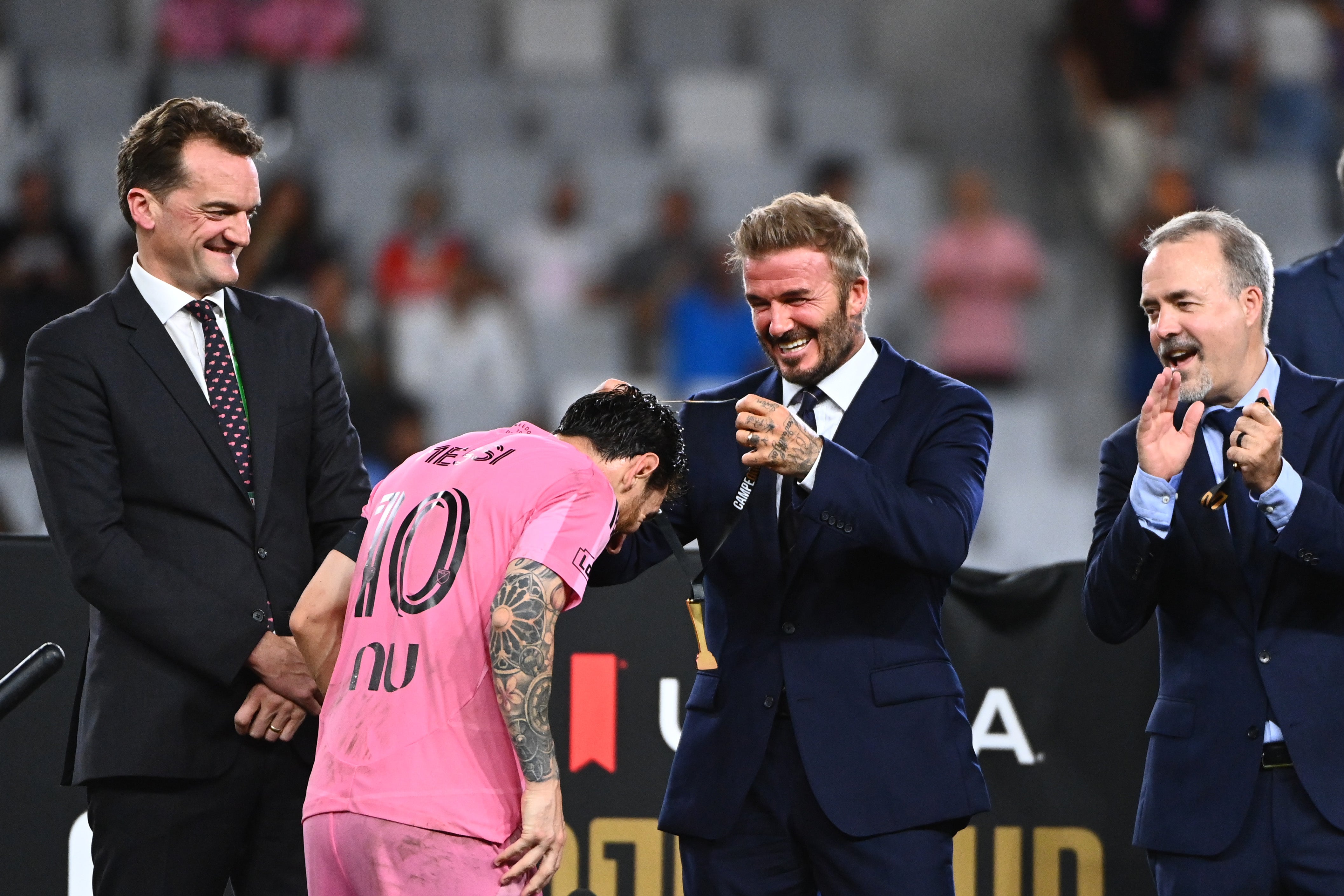 Sir David Beckham, Co-owner of Inter Miami CF, gives the winner's medal to Lionel Messi