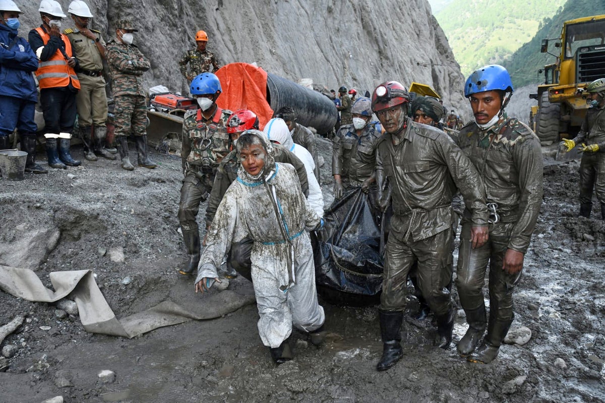 Rescuers dig 4 bodies from a Nepal hydropower tunnel as families demand answers
