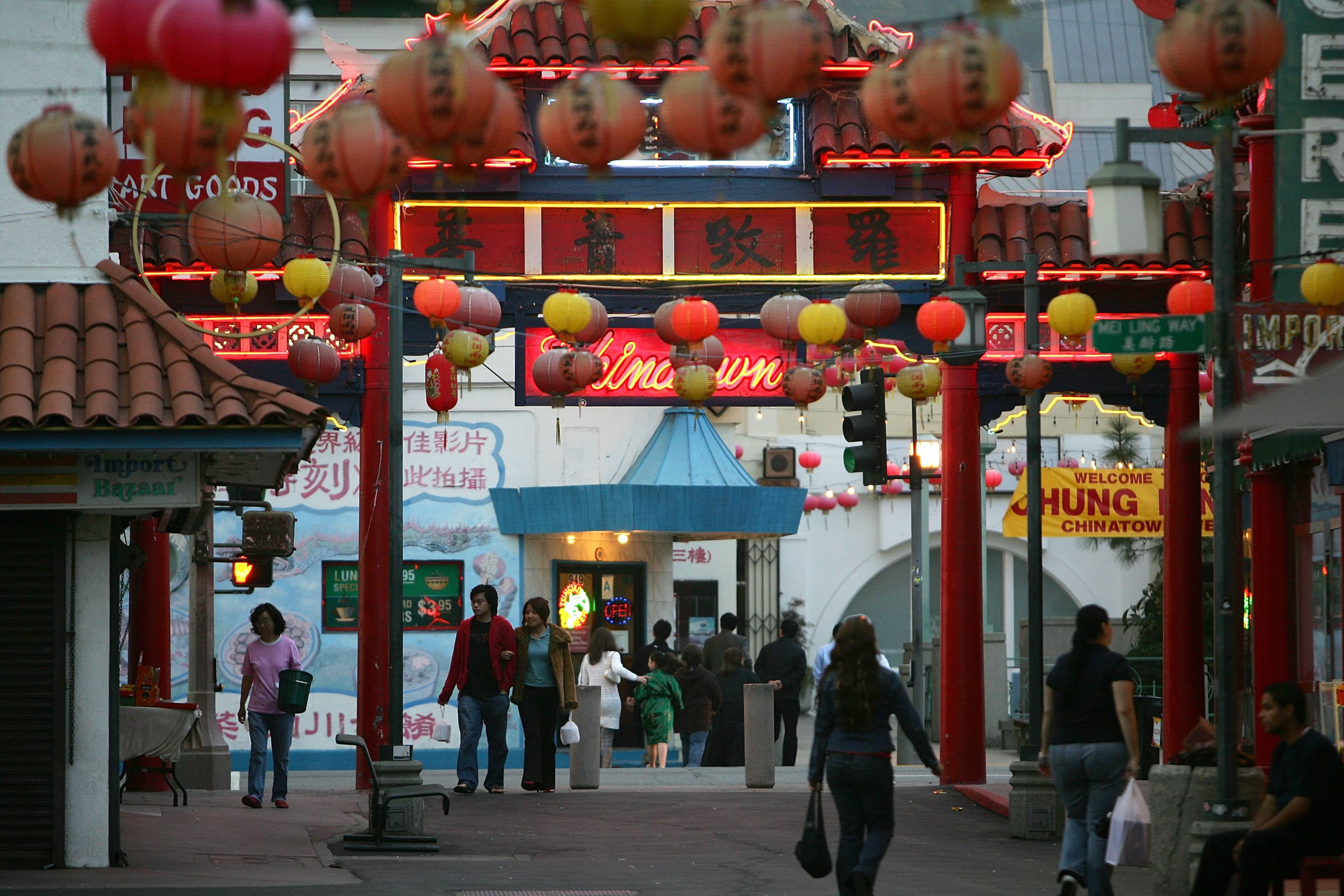 Pedestrians walk through an old section of Chinatown in Los Angeles
