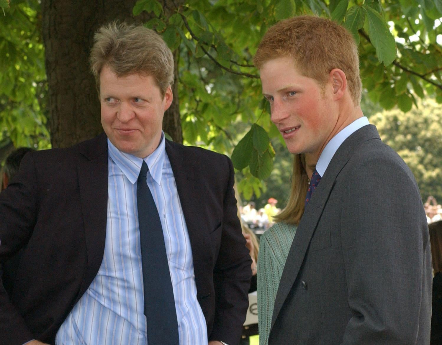 With his nephew Prince Harry at the opening of the Diana memorial fountain