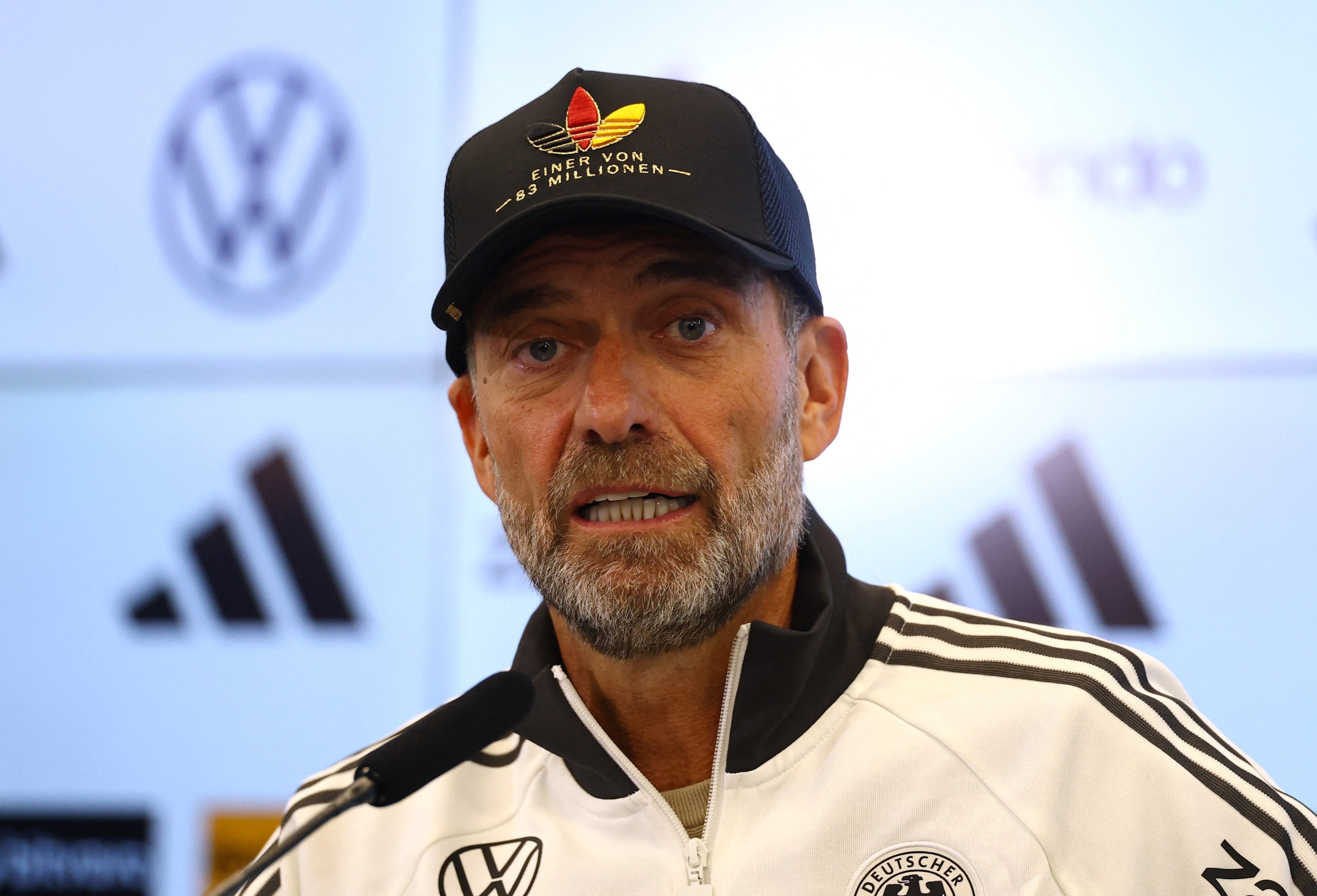 Jurgen Klopp sported an Adidas cap with colours of the Germany flag at his squad unveiling press conference