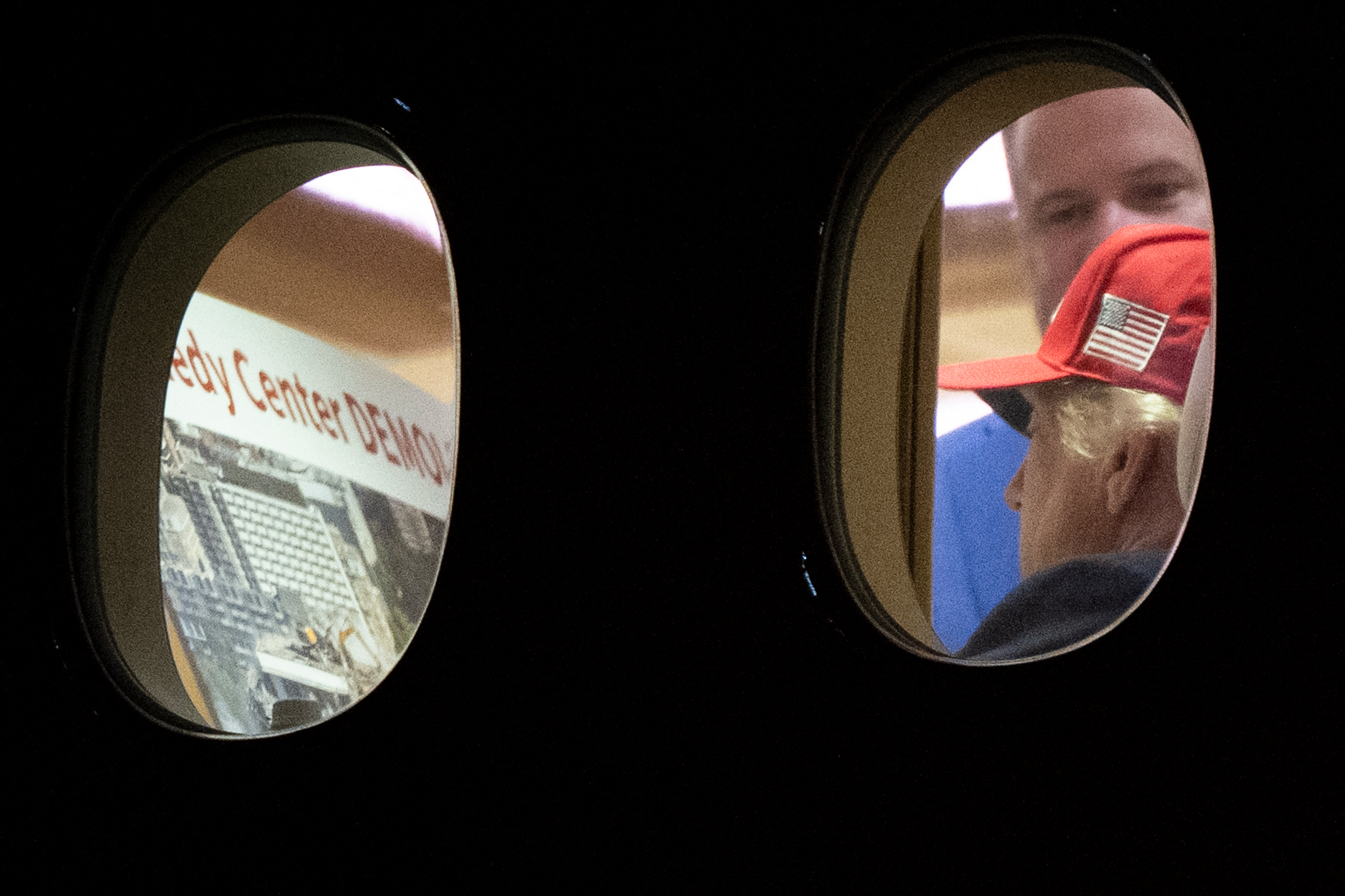 Trump was seen on Air Force One reviewing images that appear to say ‘Kennedy Center Demolition’ after the venue’s board voted to close down following a judge’s order that blocks the president from renaming it after himself