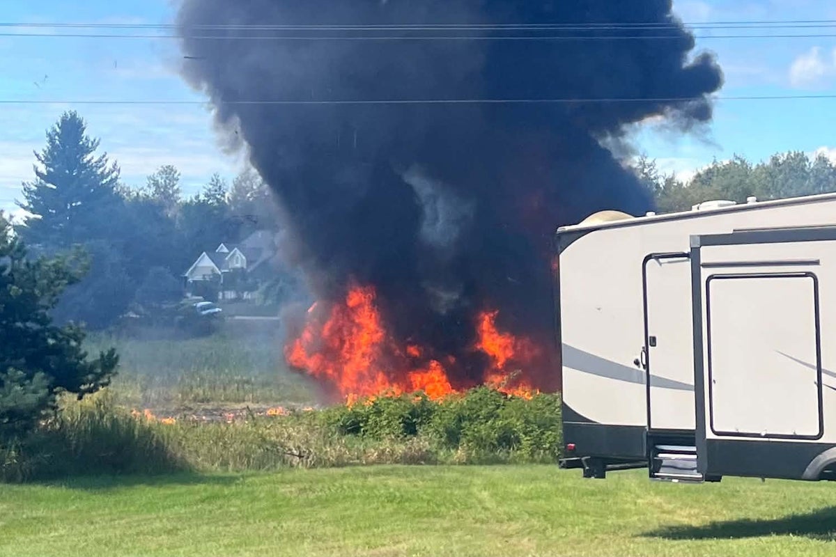 F-16 fighter jet crashes in Michigan and bursts into flames with residents told to evacuate