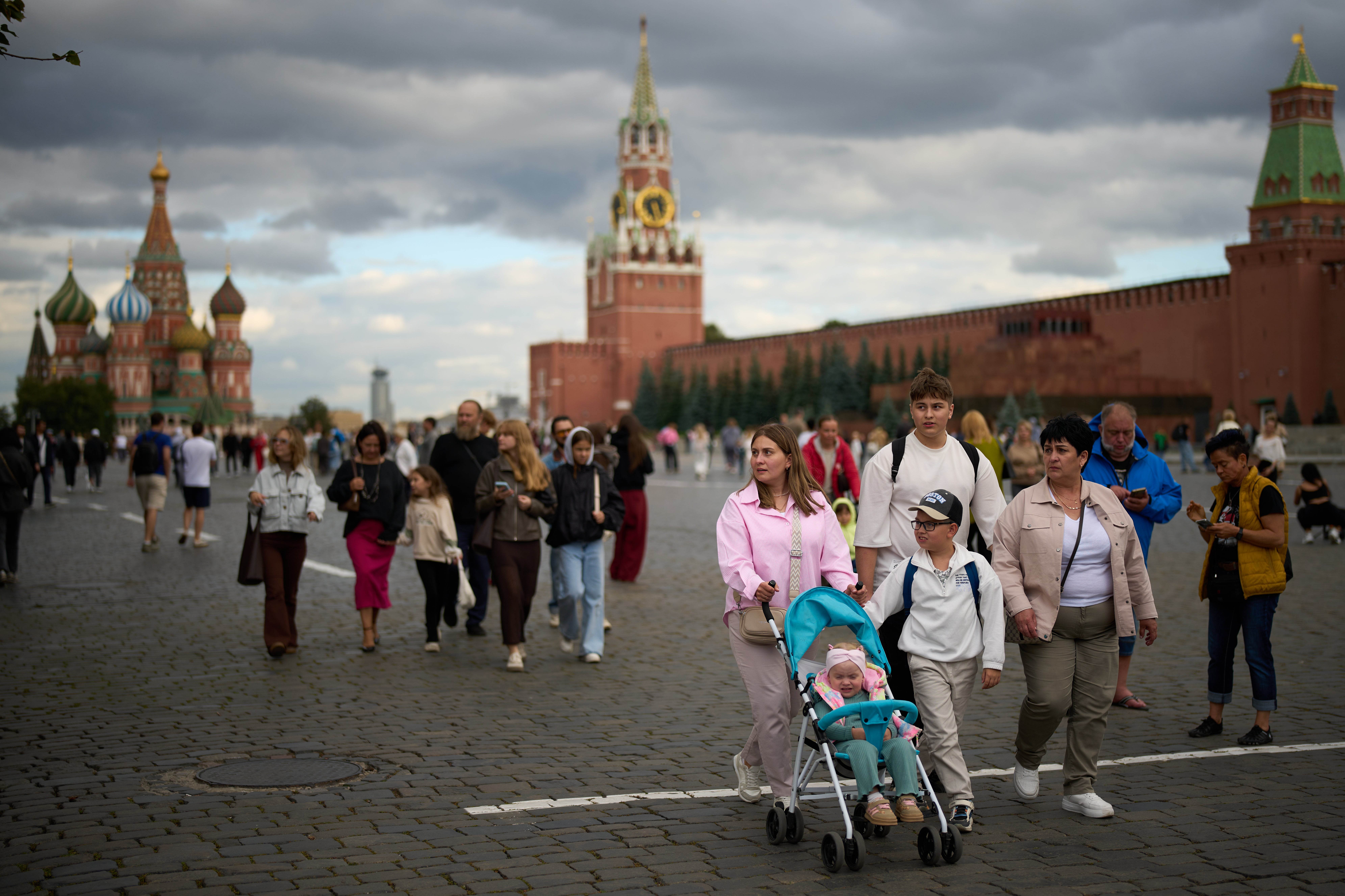 People walk through Red Square in Moscow