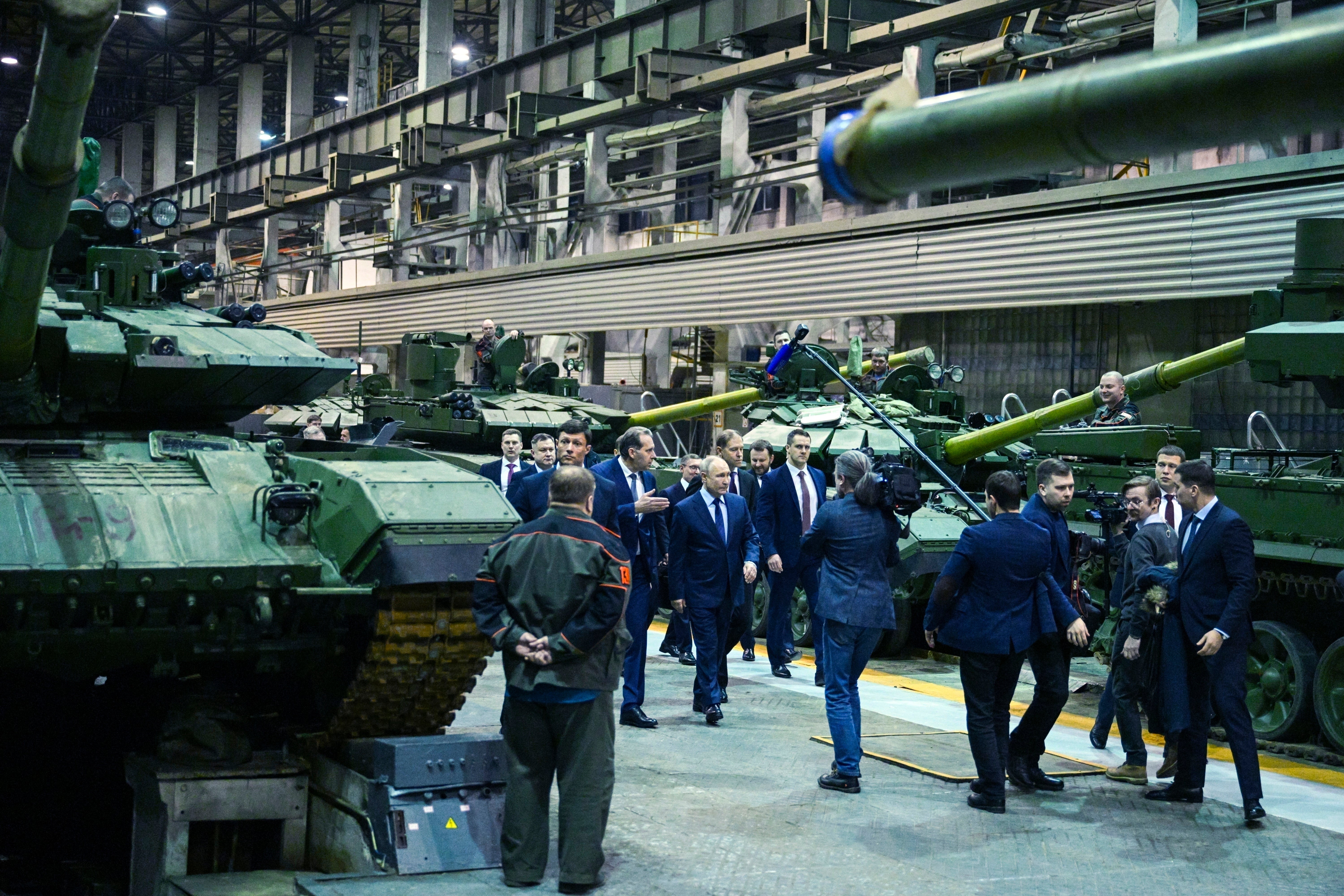 Russian President Vladimir Putin, centre, visits the Uralvagonzavod factory in Nizhny Tagil