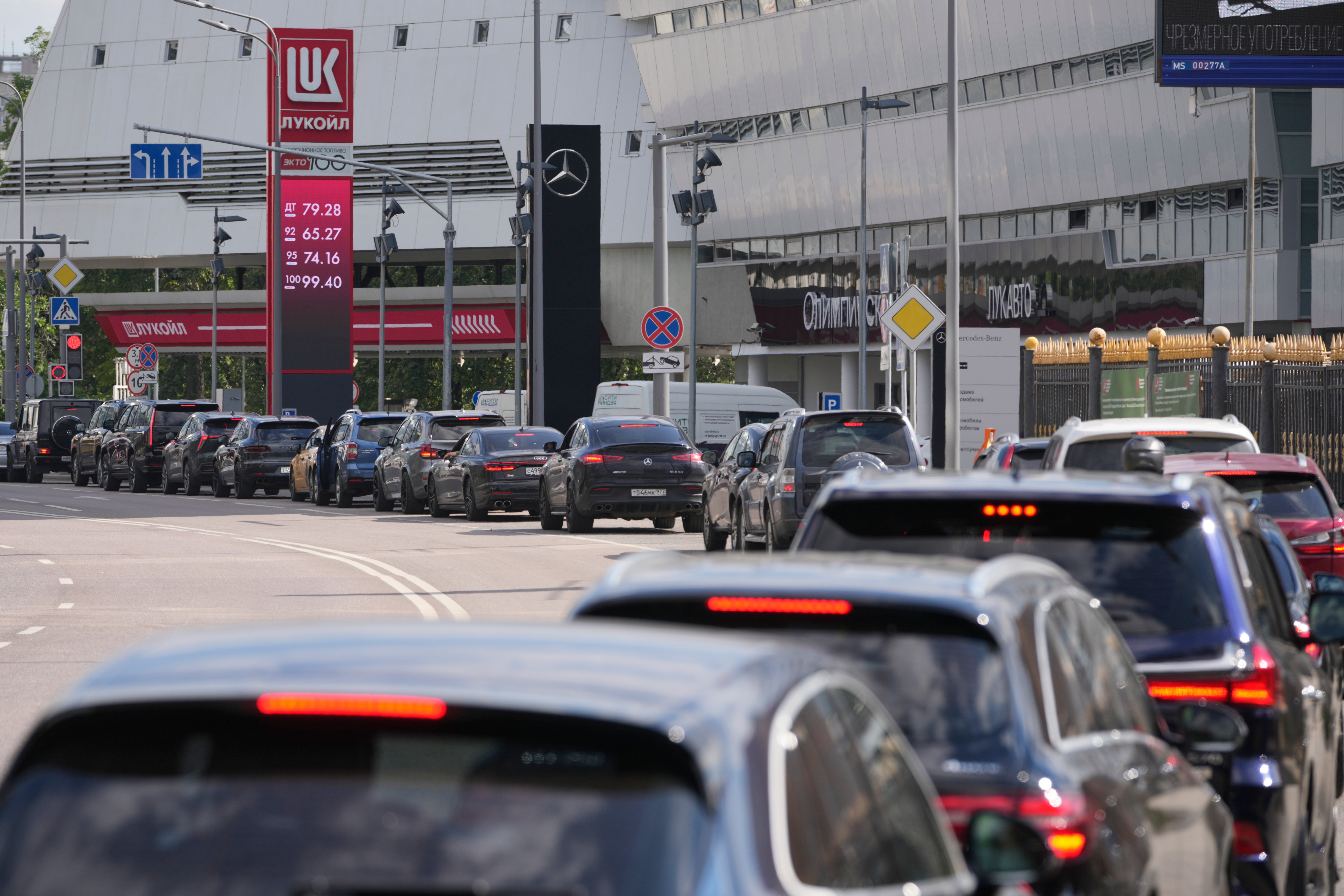 Motorists line up at a Lukoil petrol station in Moscow