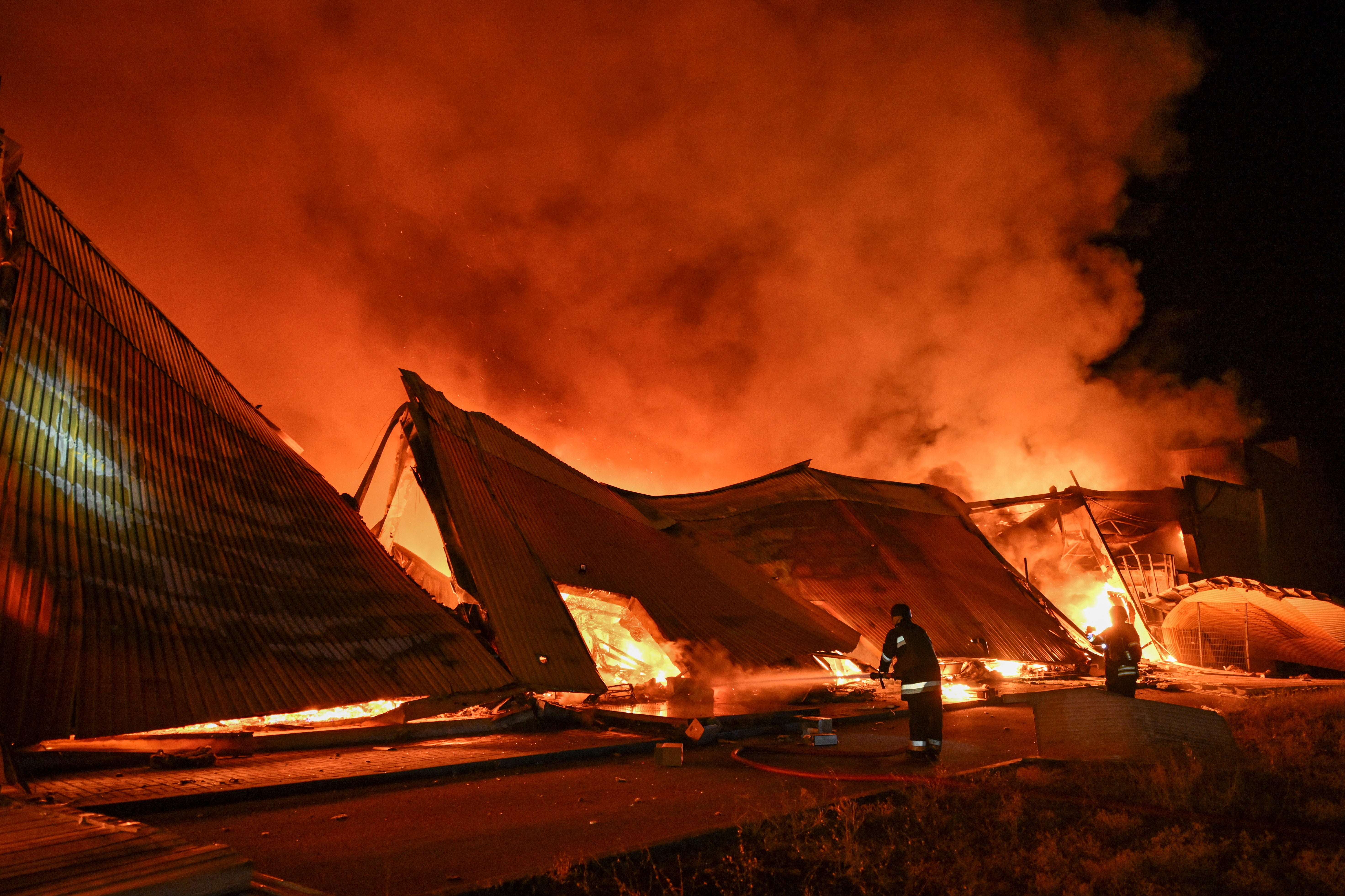 Fire crews battled a major fire at the site of the strike in Zaporizhzhia, Ukraine (Reuters)