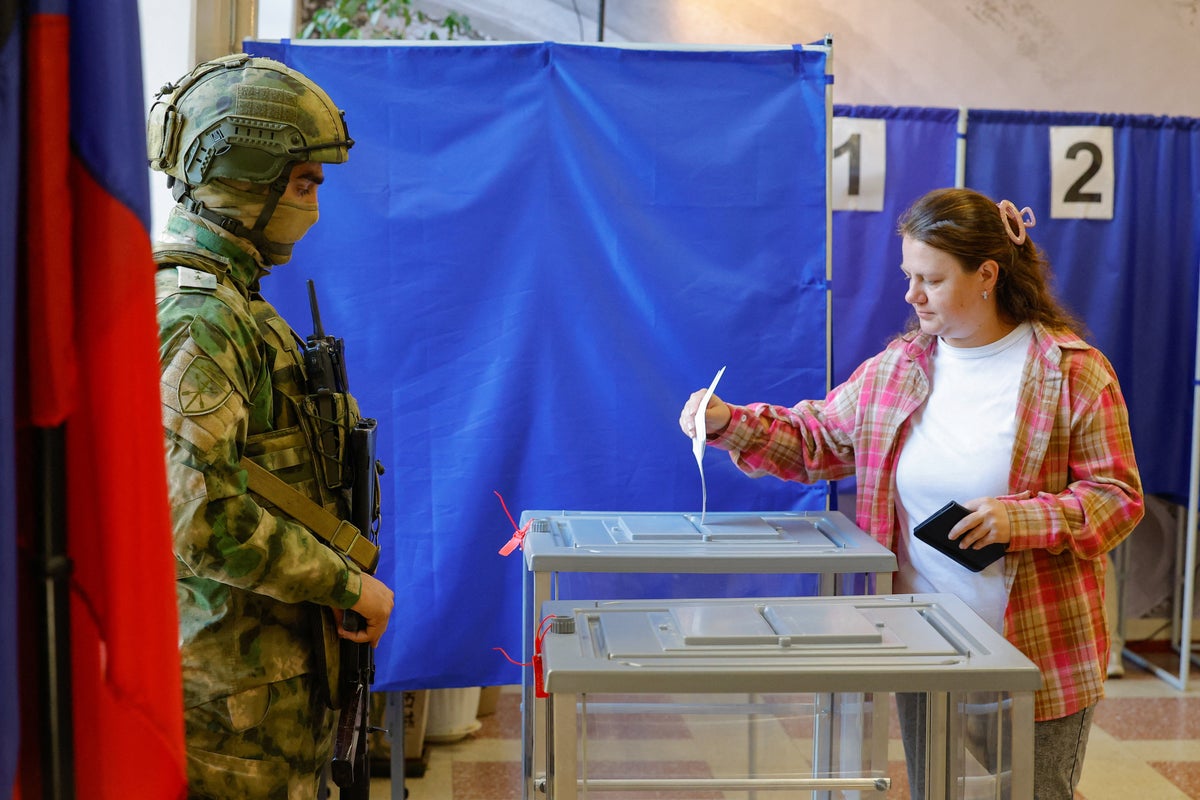 Arrests, armed soldiers and opposition parties banned: How Putin controlled Russia’s ‘sham’ elections