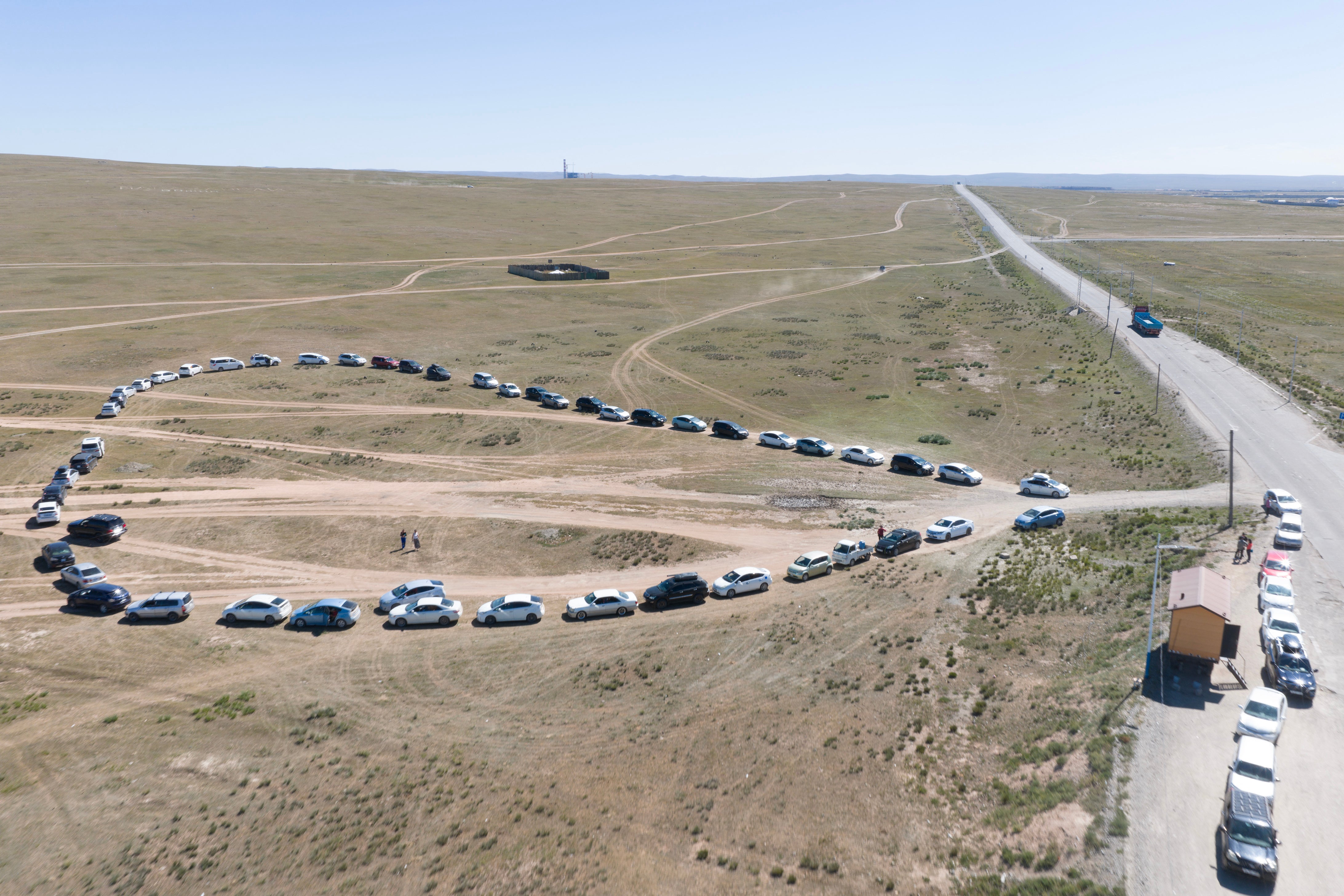 People queueing in their cars to fill up at a gas station in Bagakhangai, Mongolia, which has been gripped in recent months by a relentless fuel shortage after Ukrainian strikes on Russian oil facilities disrupted supply