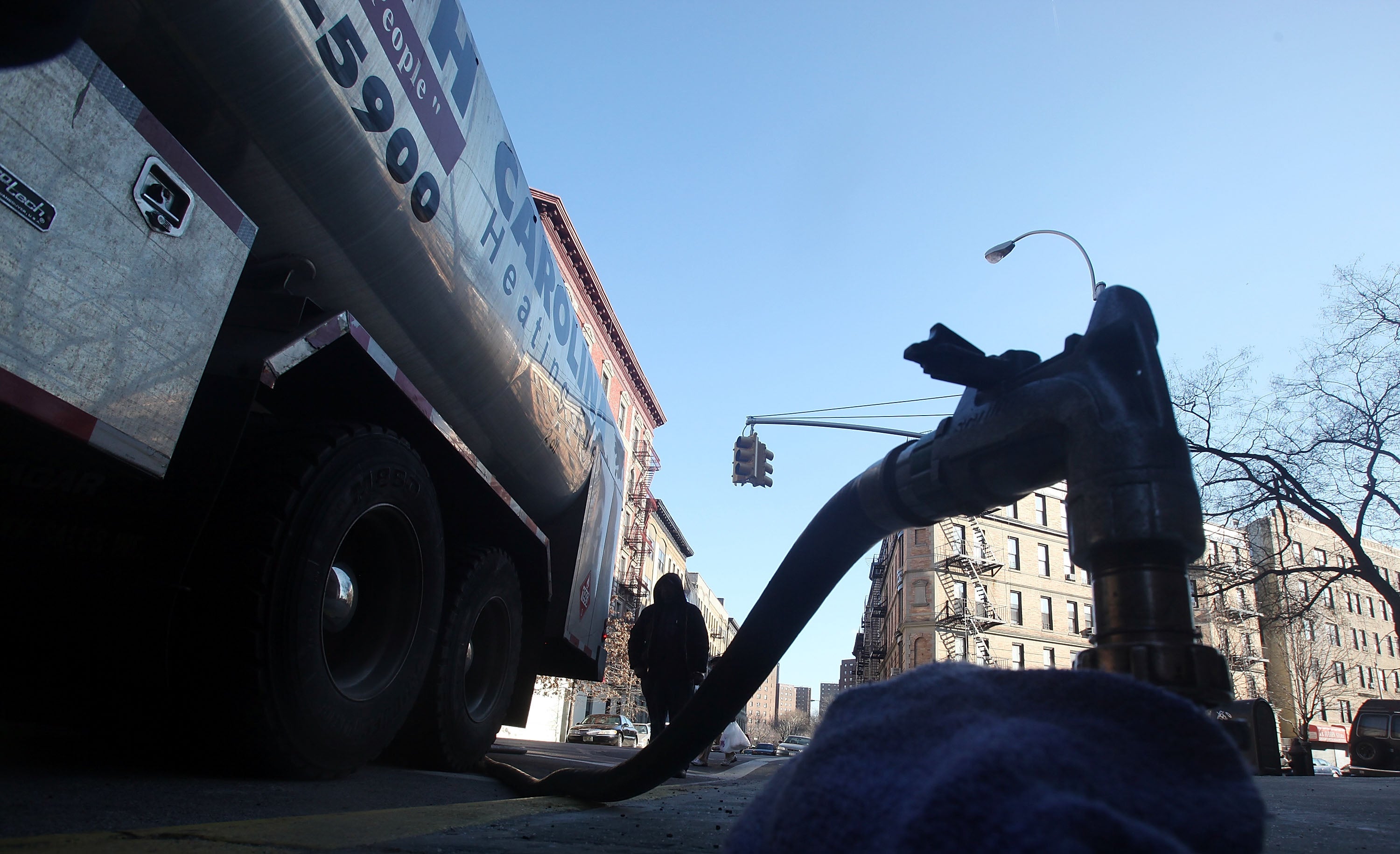 A South Carolina Heating Fuel employee delivers heating oil to a building in Harlem January 12, 2010 in New York City (Getty Images)