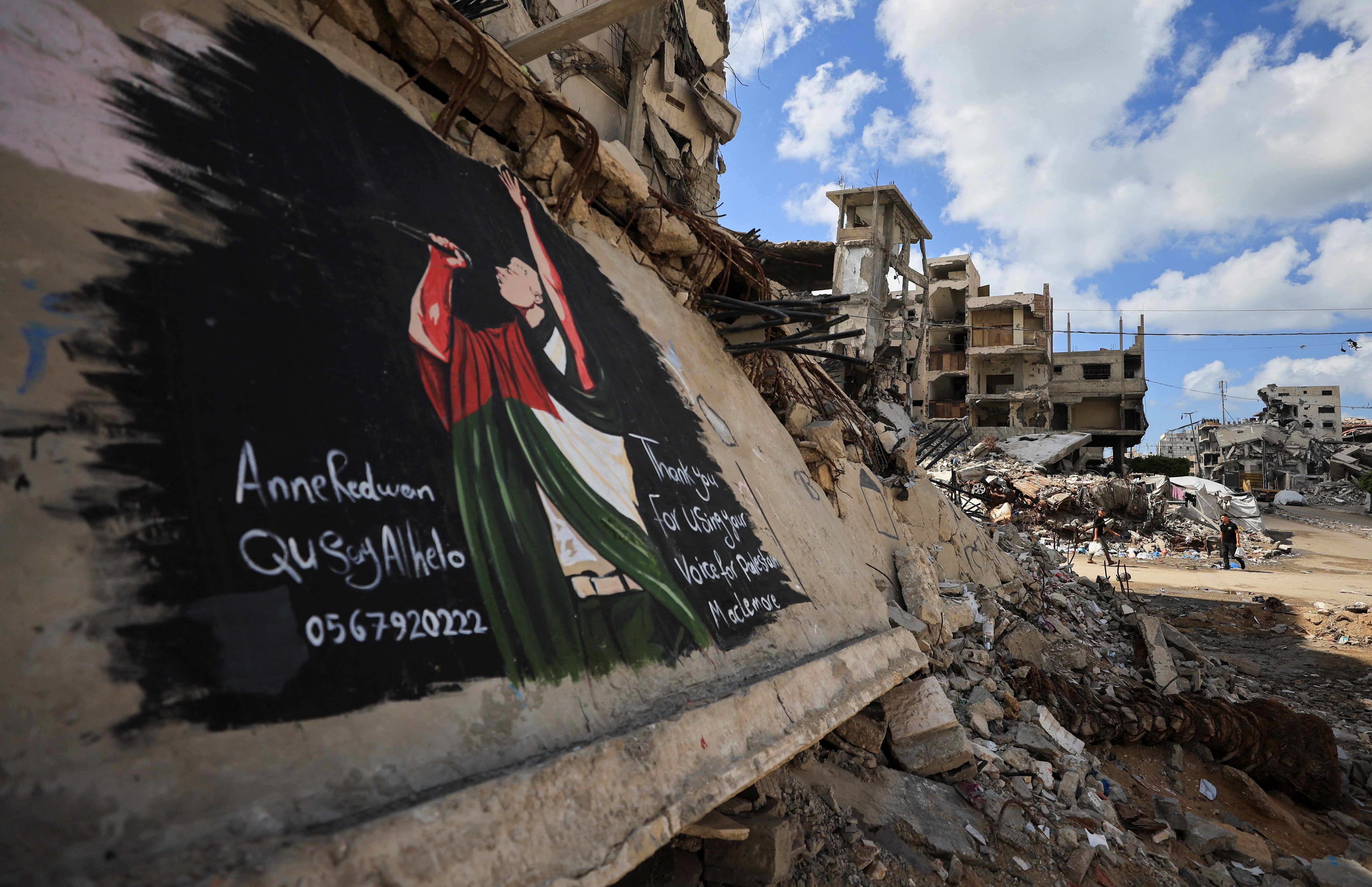 A mural of Macklemore painted in Gaza this week on buildings destroyed during the war (Reuters)