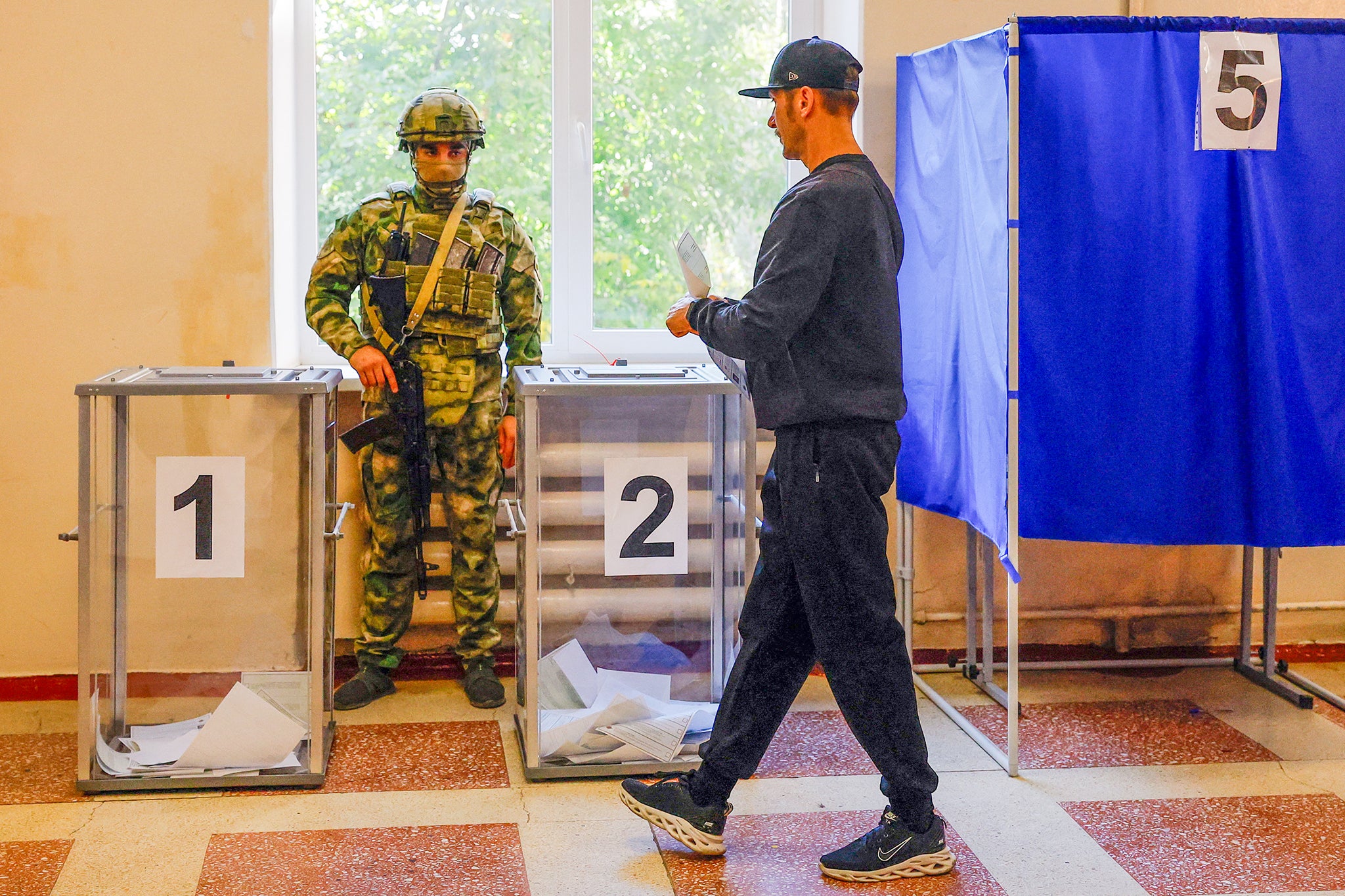A man votes in Donetsk (Reuters)