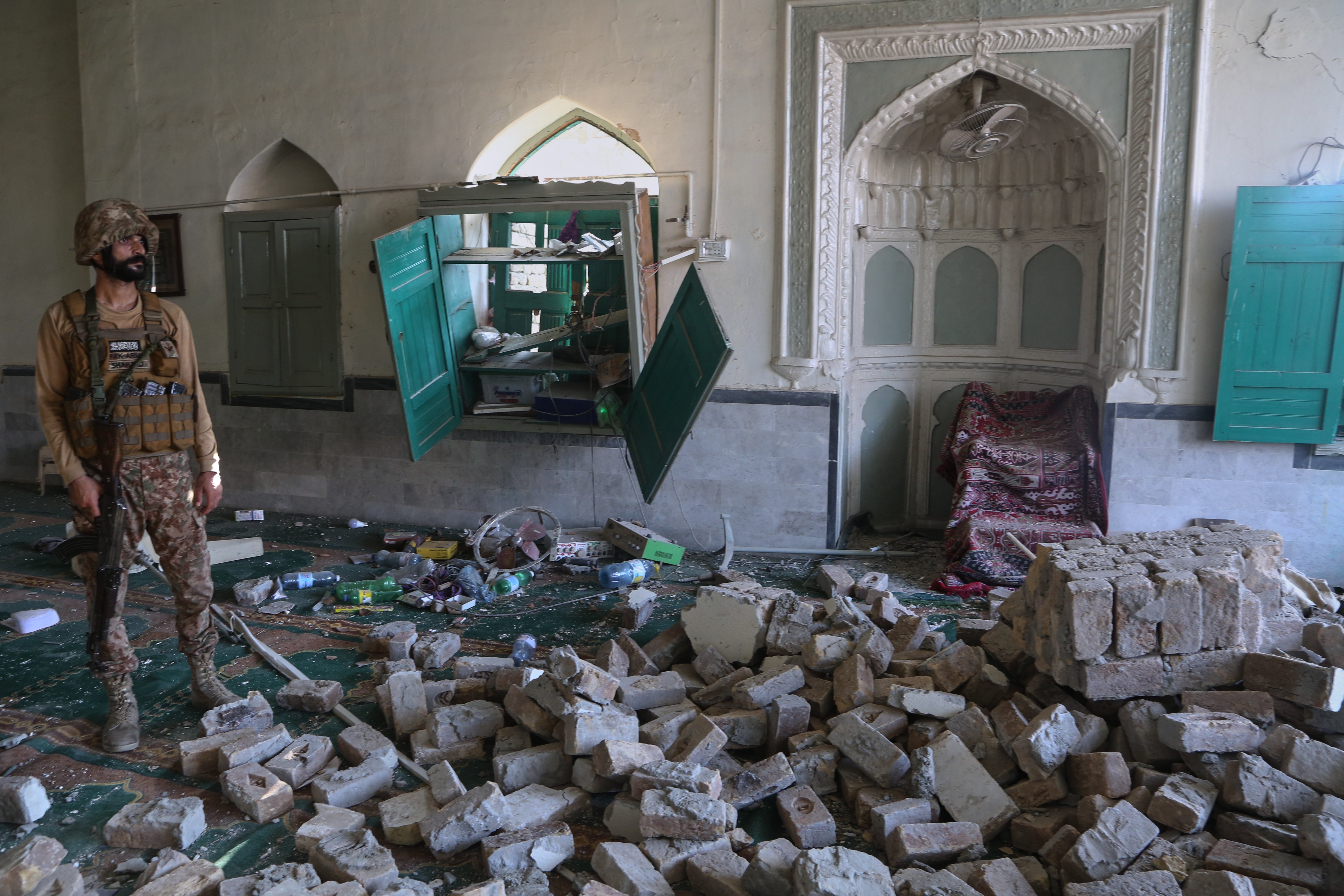 An Army soldier examines damage at the site after a bomb exploded at a mosque in Kohat, in northwestern Pakistan, Friday (Copyright 2026 The Associated Press. All rights reserved.)