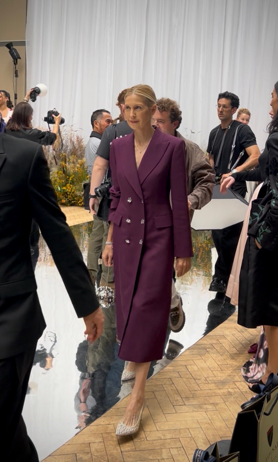 Kelly Rutherford wore a plum Patrick McDowell coat dress to their SS27 show (Lara Owen/PA)