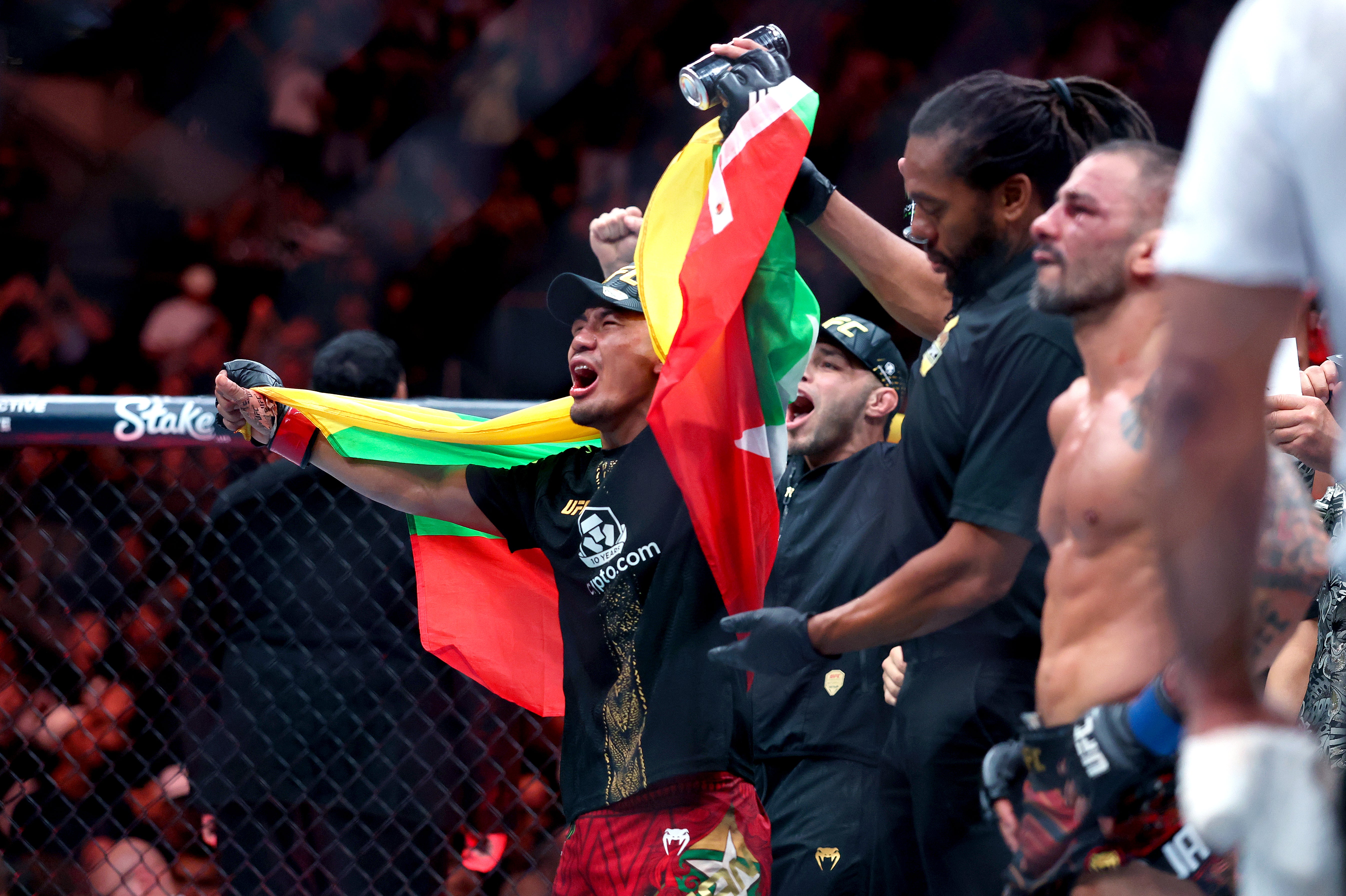 Joshua Van celebrates a second successful flyweight-title defence