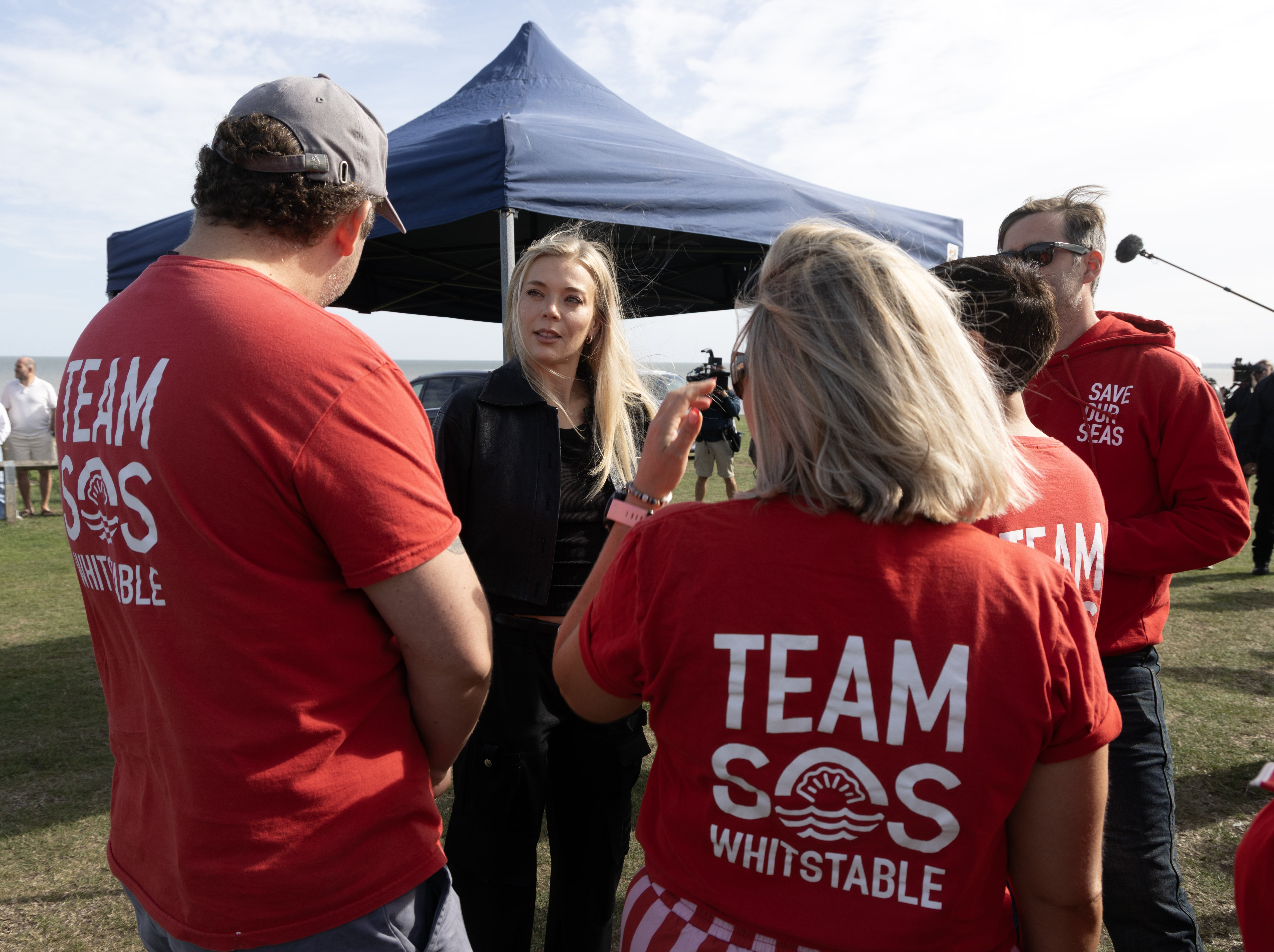 Singer Becky Hill speaks to campaigners