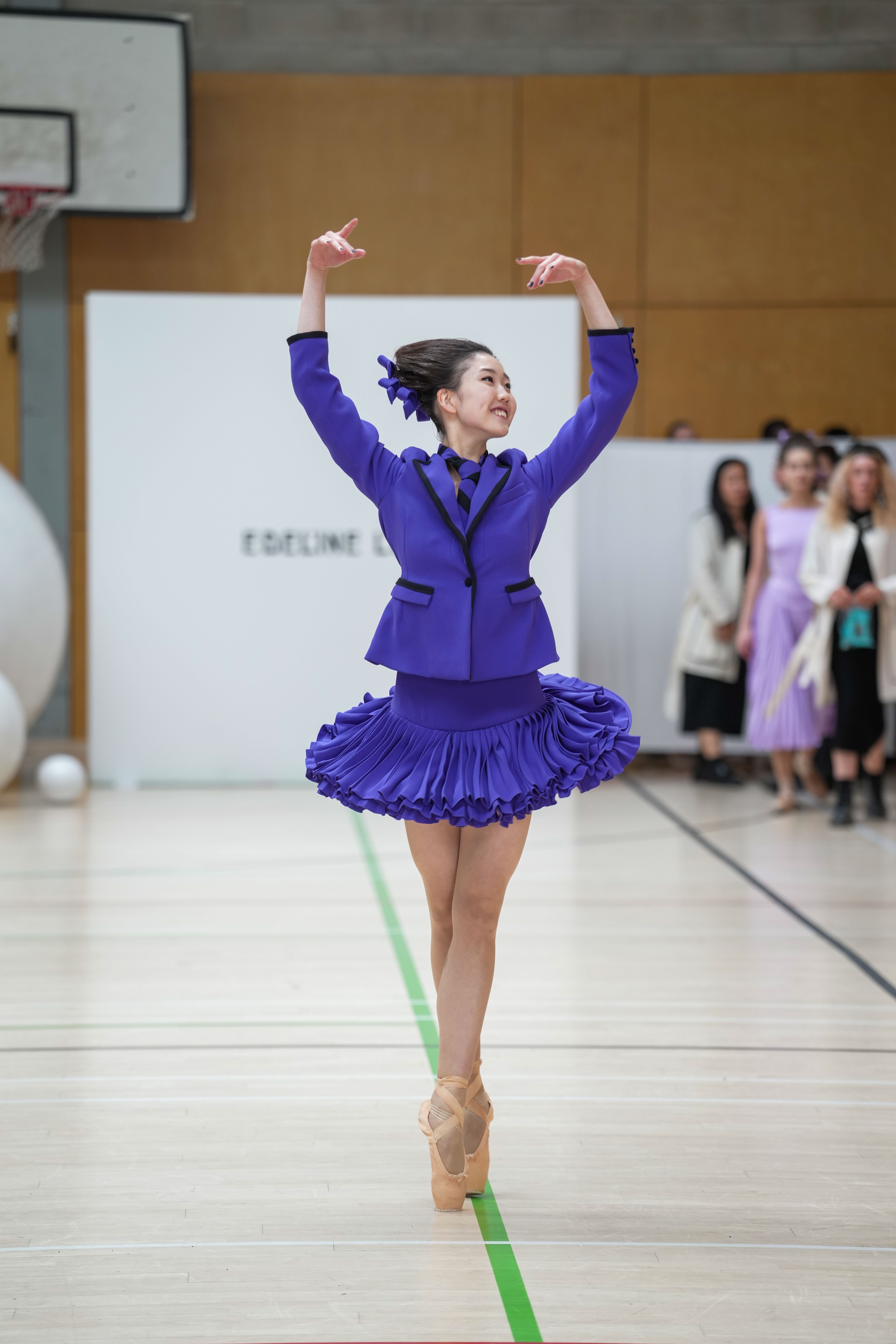 A ballet dancer in one of Lee’s vibrant purple designs (Jeff Moore/PA)