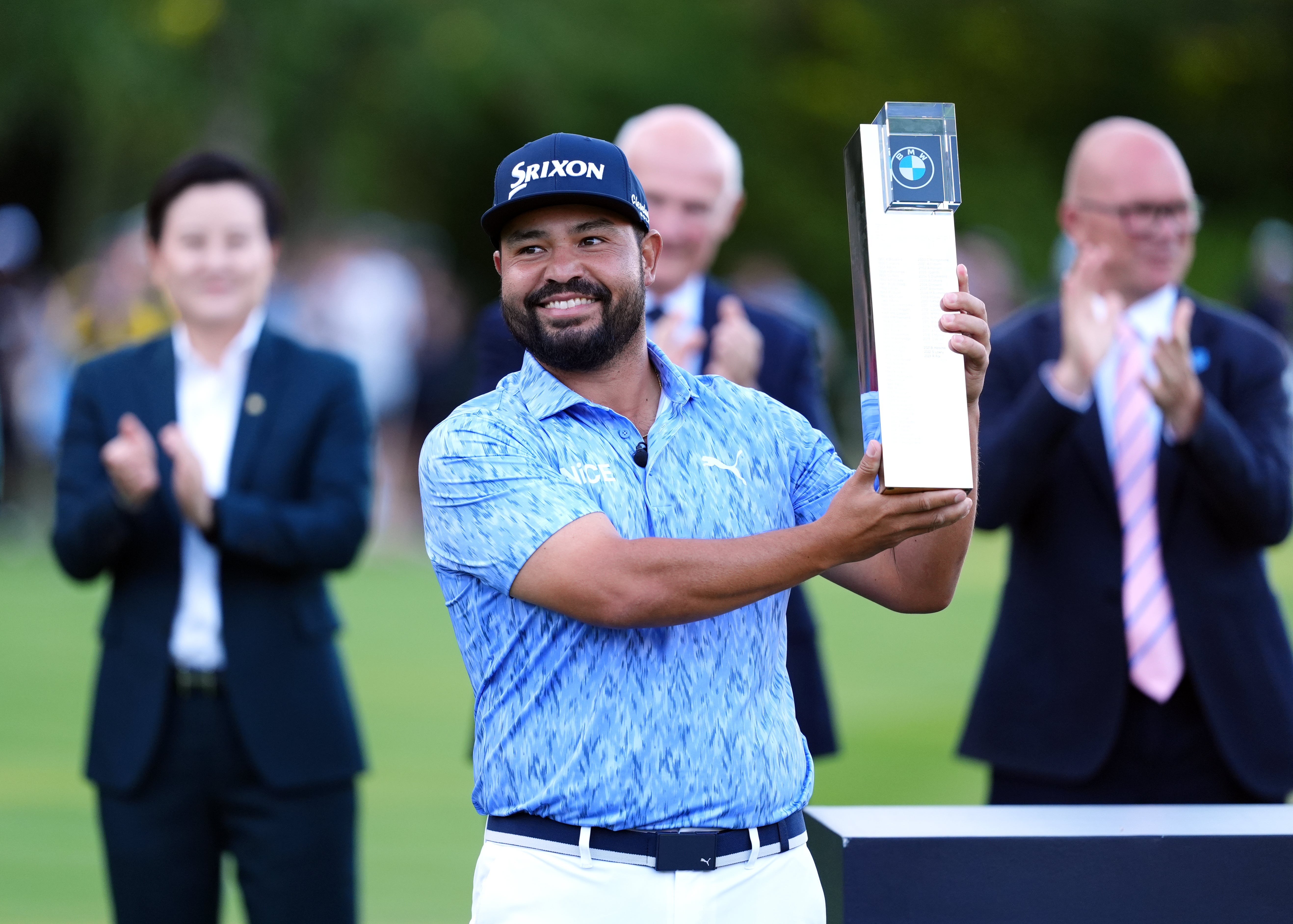 JJ Spaun celebrates with the trophy