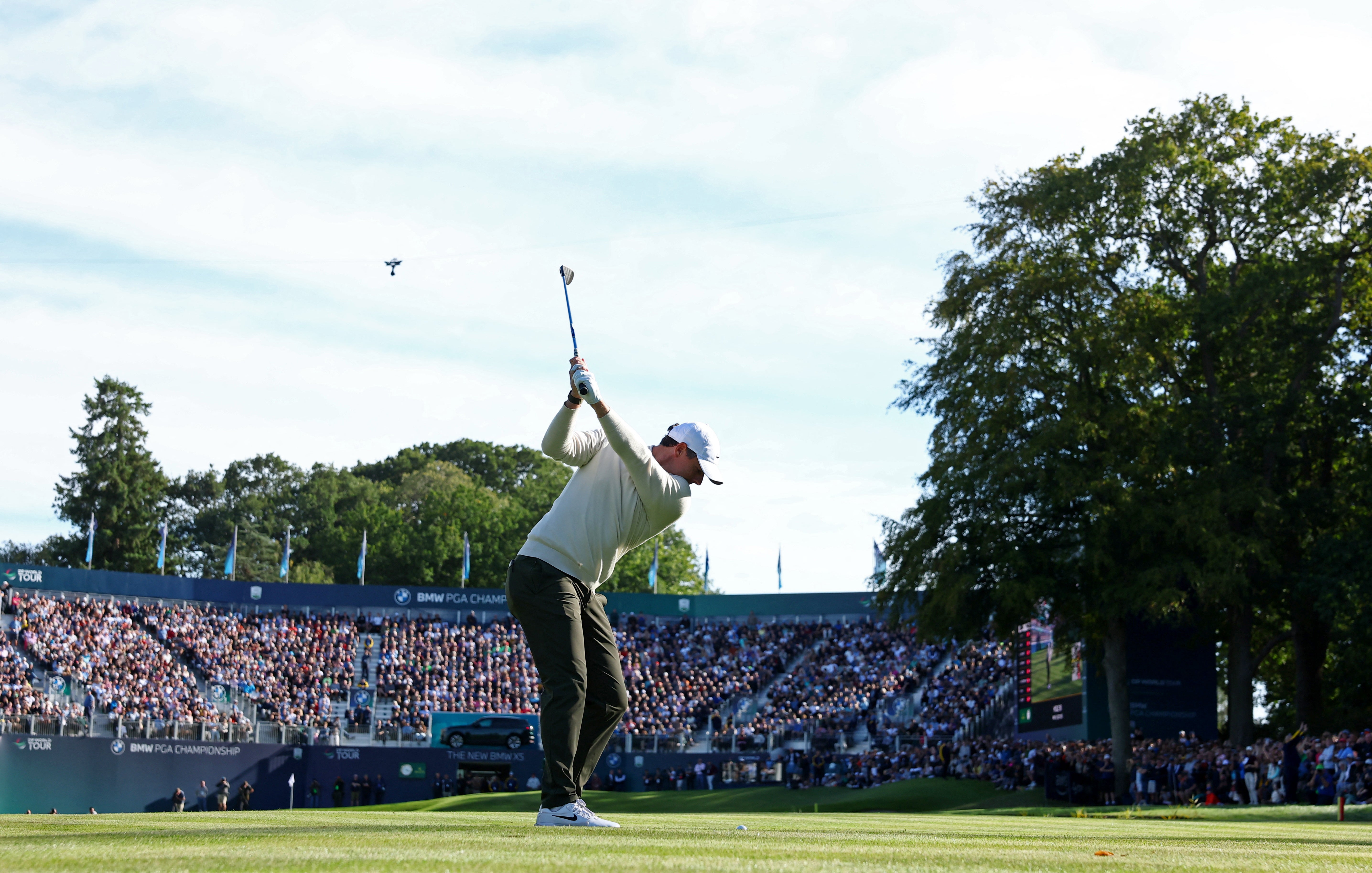 McIlroy hits his approach to the 18th green