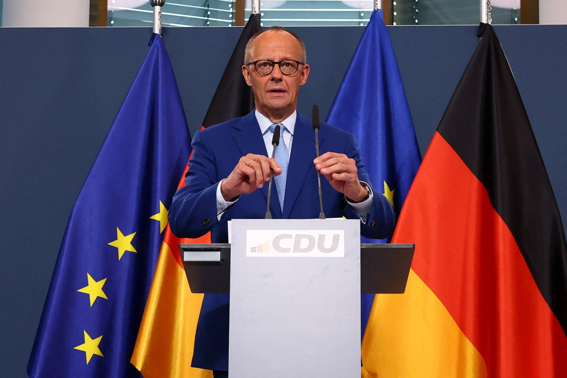German Chancellor Friedrich Merz gives a statement after first exit polls
