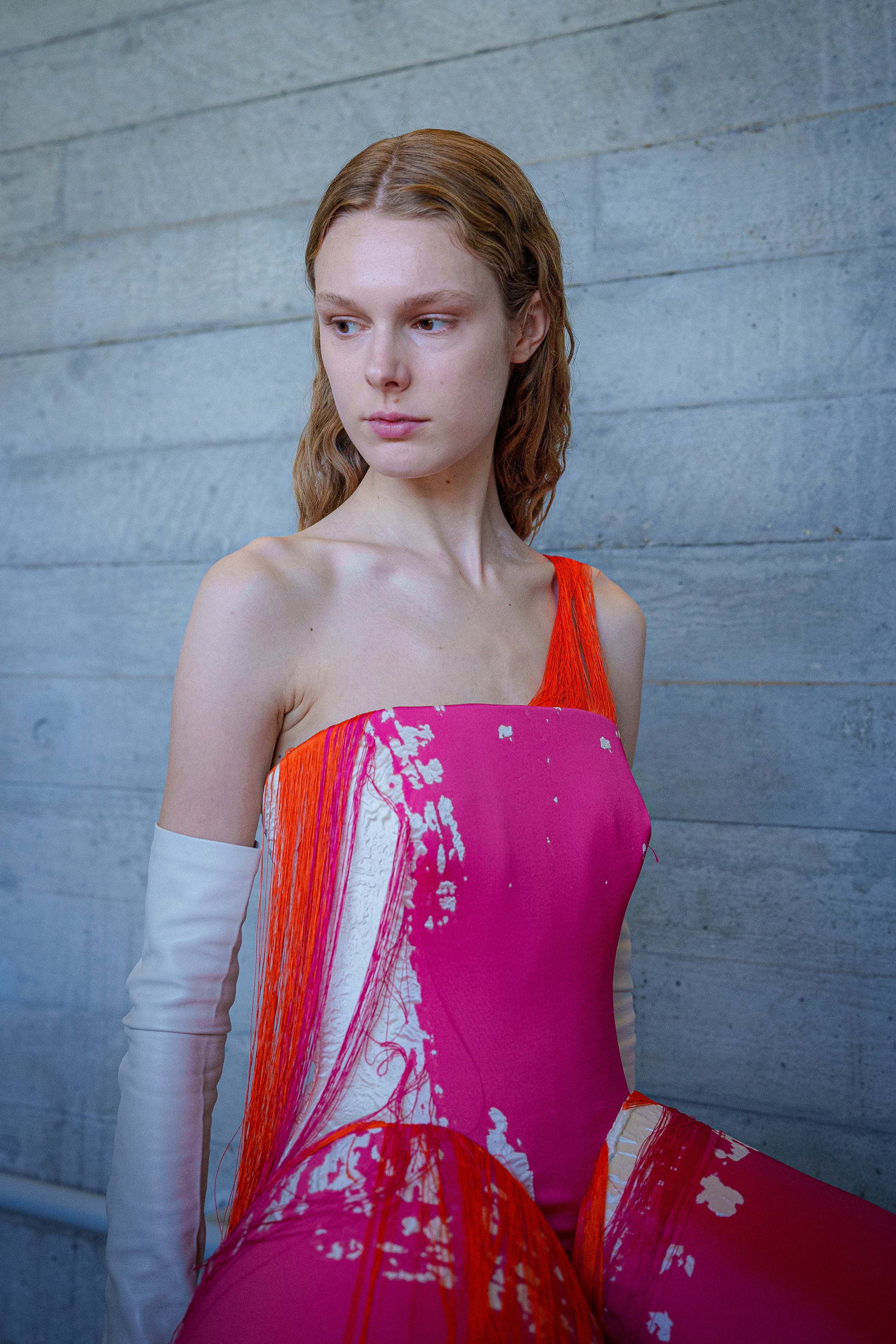 Loose threads and leather opera gloves were key motifs from the show (Joss